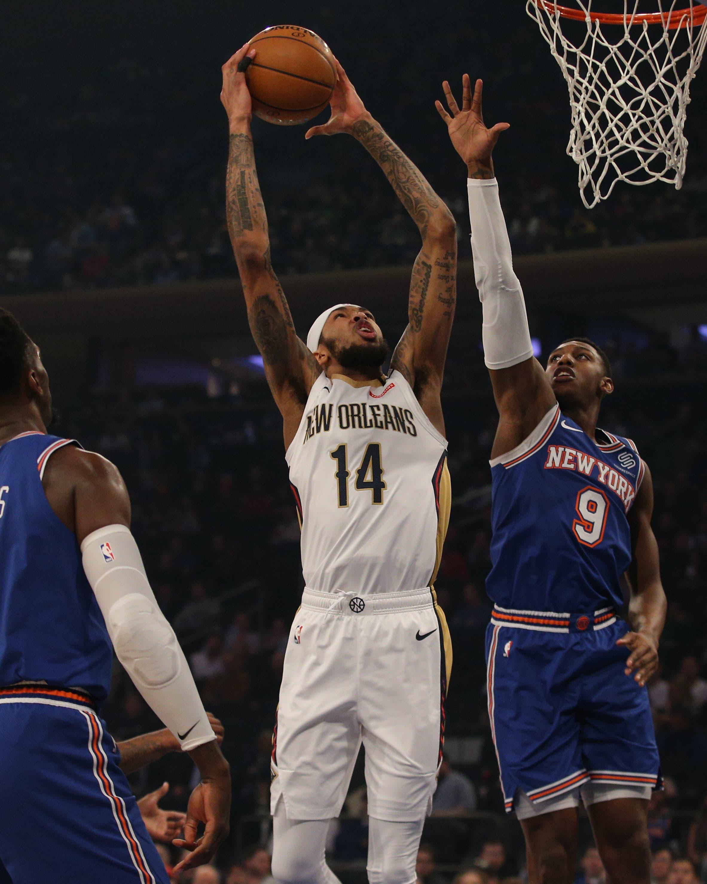 Jan 10, 2020; New York, New York, USA; New Orleans Pelicans small forward Brandon Ingram (14) drives to the basket against New York Knicks power forward Bobby Portis (1) and shooting guard RJ Barrett (9) during the first quarter at Madison Square Garden. Mandatory Credit: Brad Penner-USA TODAY Sportsundefined