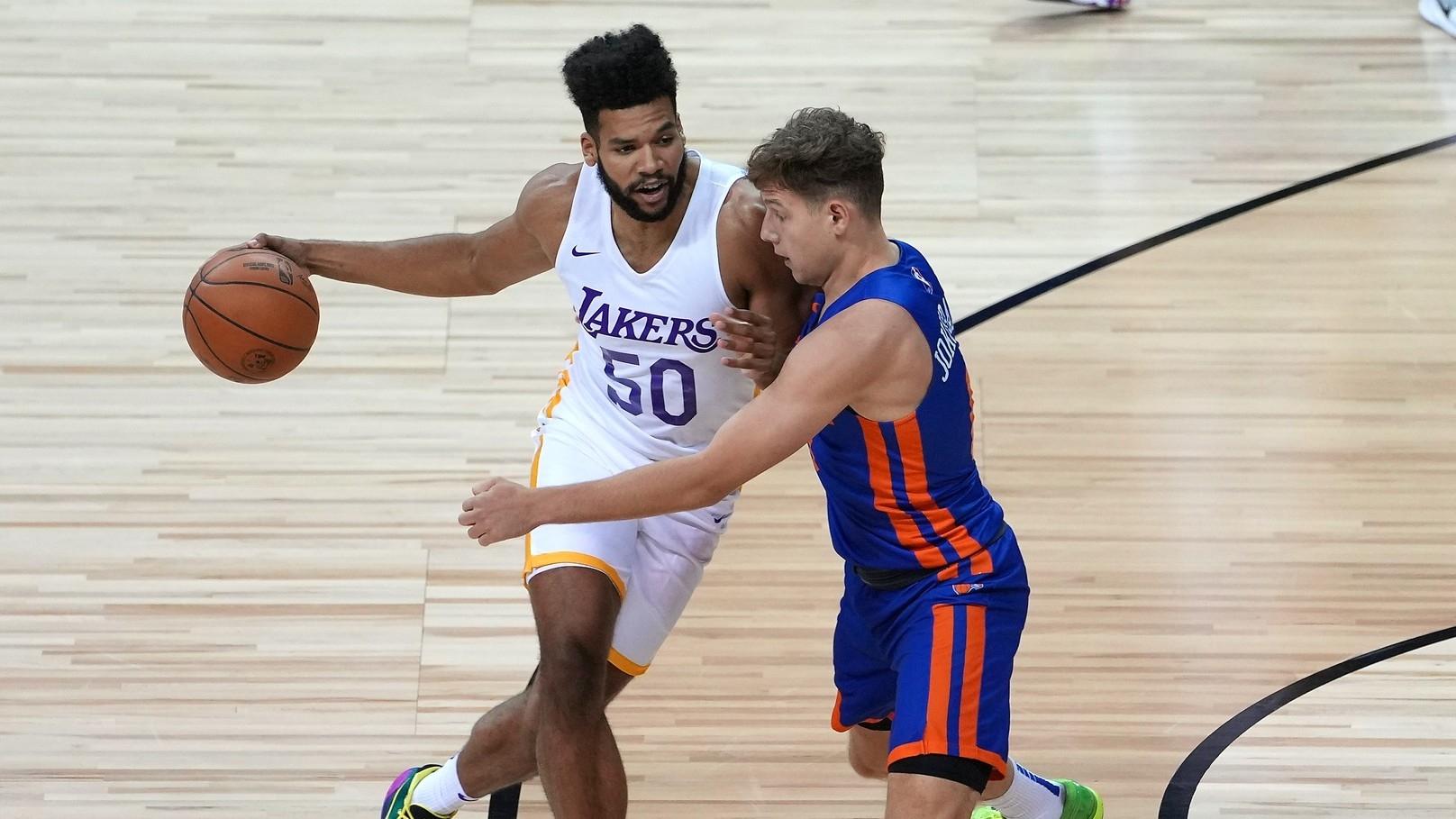 Los Angeles Lakers forward Yoeli Childs (50) dribbles against New York Knicks guard Rokas Jokubaitis (0) during an NBA Summer League game at Thomas & Mack Center. 