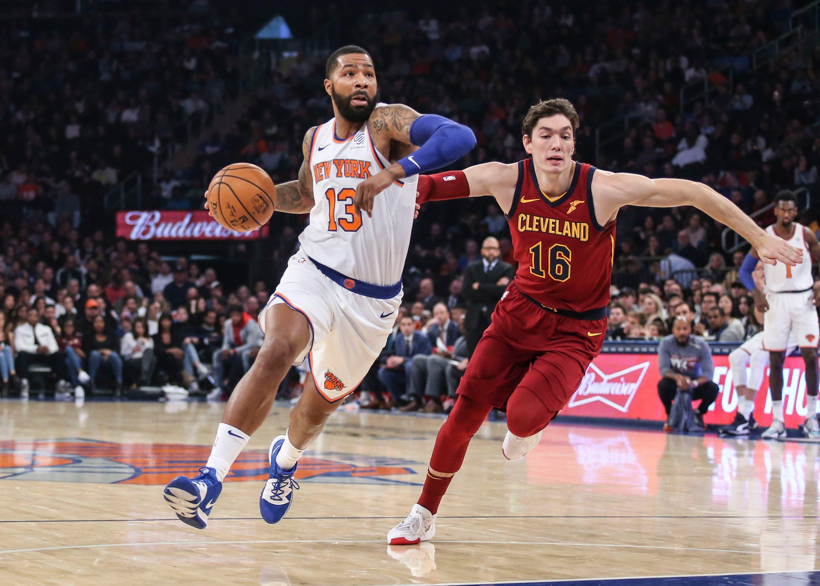 Nov 10, 2019; New York, NY, USA; New York Knicks forward Marcus Morris Sr (13) drives past Cleveland Cavaliers forward Cedi Osman (16) in the first quarter at Madison Square Garden. Mandatory Credit: Wendell Cruz-USA TODAY Sports / Wendell Cruz