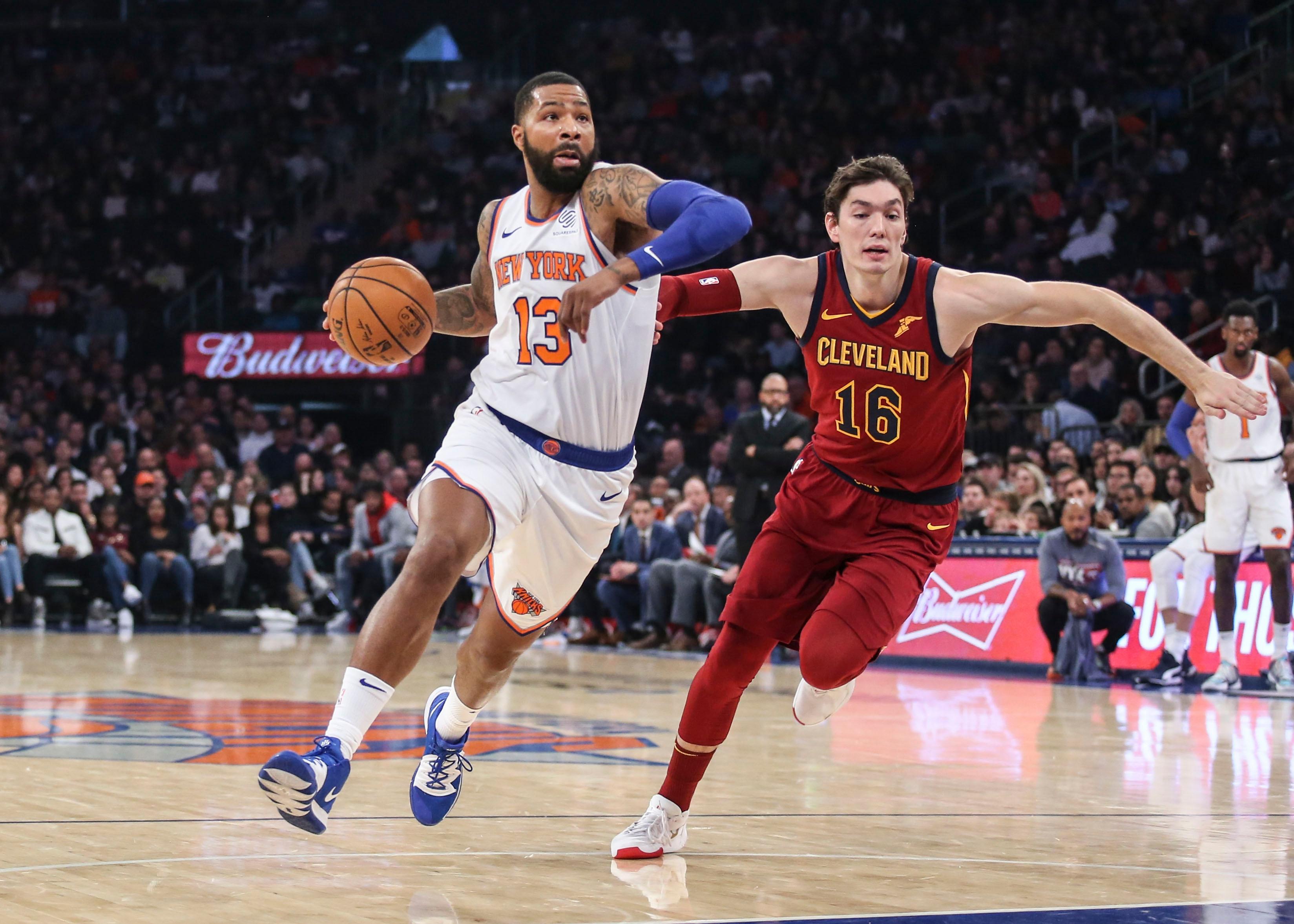 Nov 10, 2019; New York, NY, USA; New York Knicks forward Marcus Morris Sr (13) drives past Cleveland Cavaliers forward Cedi Osman (16) in the first quarter at Madison Square Garden. Mandatory Credit: Wendell Cruz-USA TODAY Sports