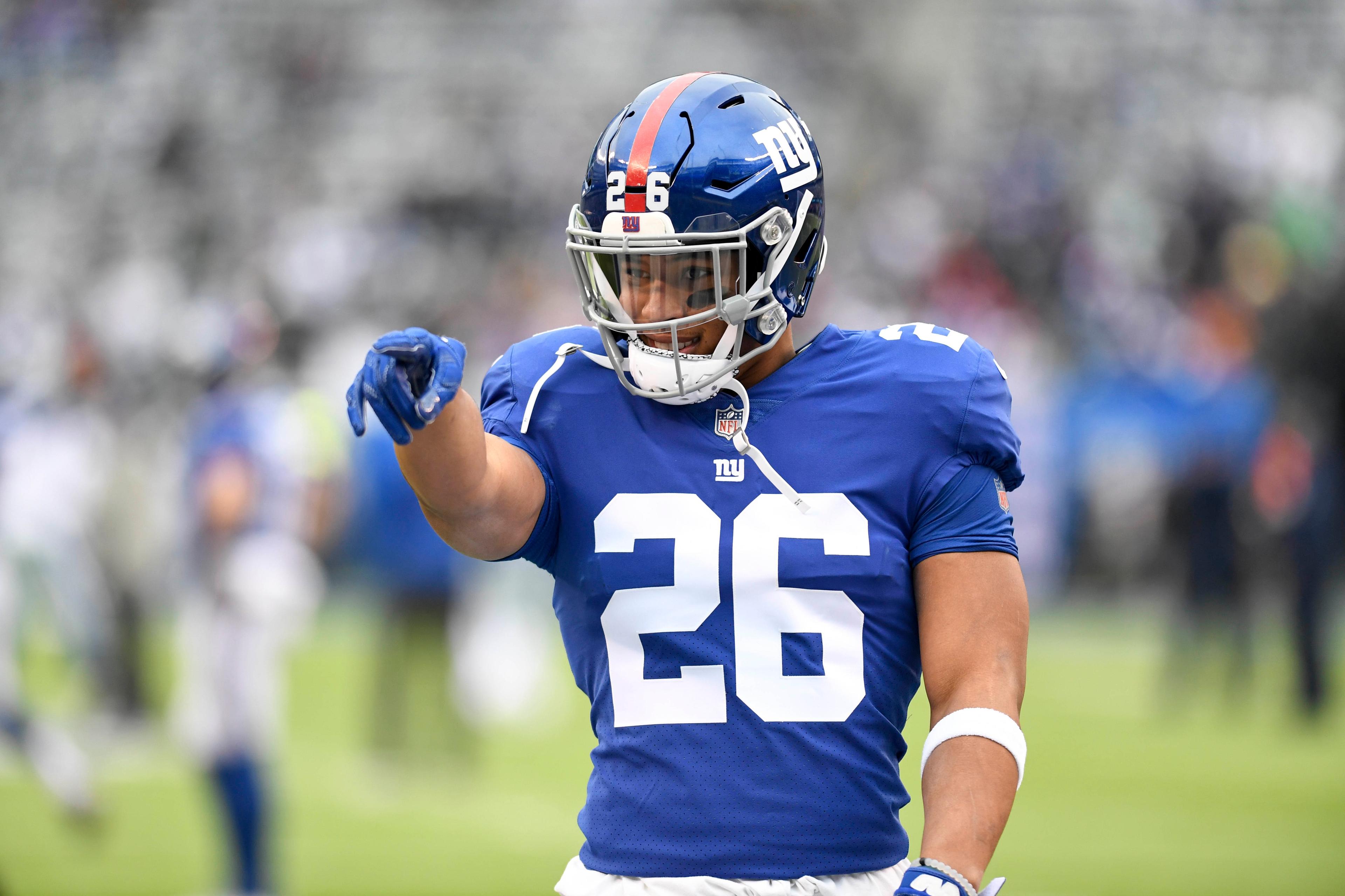 Dec 30, 2018; East Rutherford, NJ, USA; New York Giants running back Saquon Barkley (26) points to his family on the sideline during warmups before a game against the Dallas Cowboys at MetLife Stadium. Mandatory Credit: Danielle Parhizkaran/NorthJersey.com via USA TODAY NETWORK