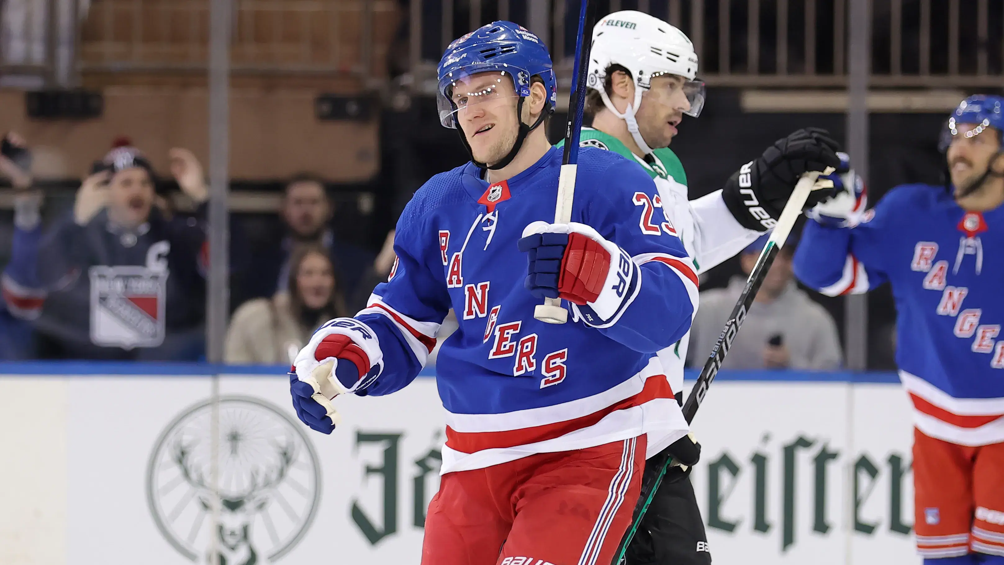 New York Rangers defenseman Adam Fox (23) celebrates his goal against the Dallas Stars in front of Stars center Craig Smith (15) during the first period at Madison Square Garden. / Brad Penner-USA TODAY Sports