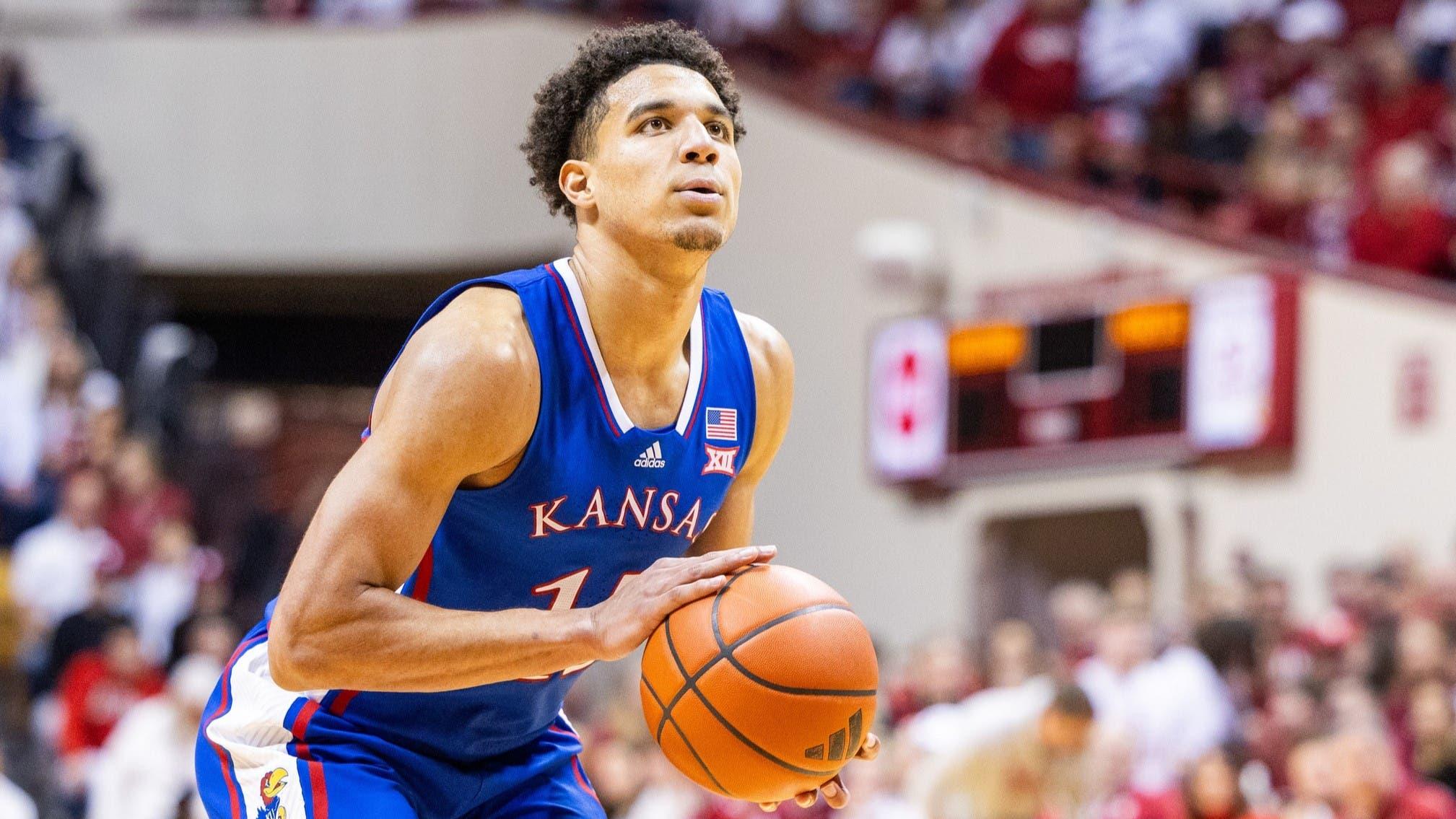 Dec 16, 2023; Bloomington, Indiana, USA; Kansas Jayhawks guard Kevin McCullar Jr. (15) shoots the ball in the second half against the Indiana Hoosiers at Simon Skjodt Assembly Hall. / Trevor Ruszkowski-USA TODAY Sports