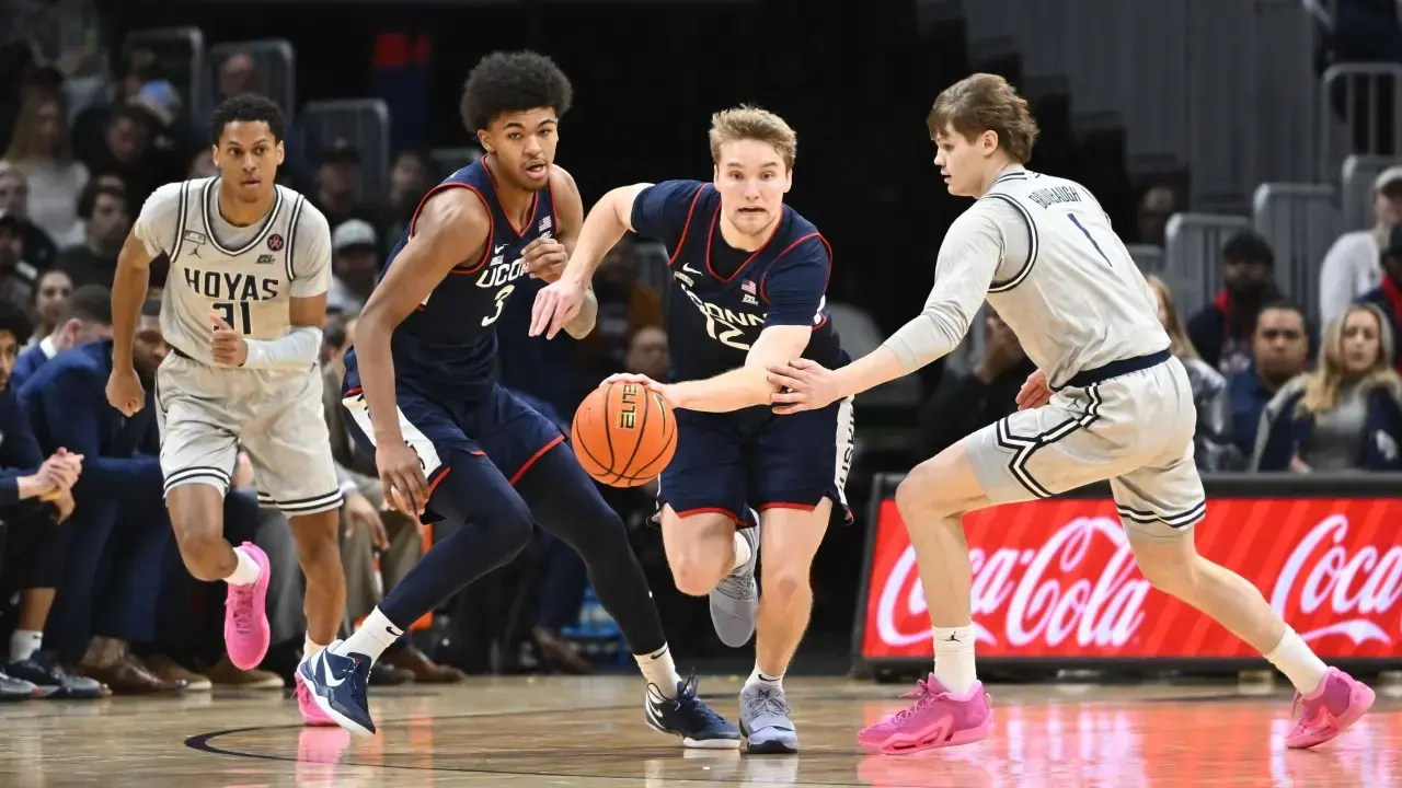 Connecticut Huskies guard Cam Spencer (12) leads a fast break against Georgetown during the first half at Capital One Arena. / Brad Mills-USA TODAY Sports