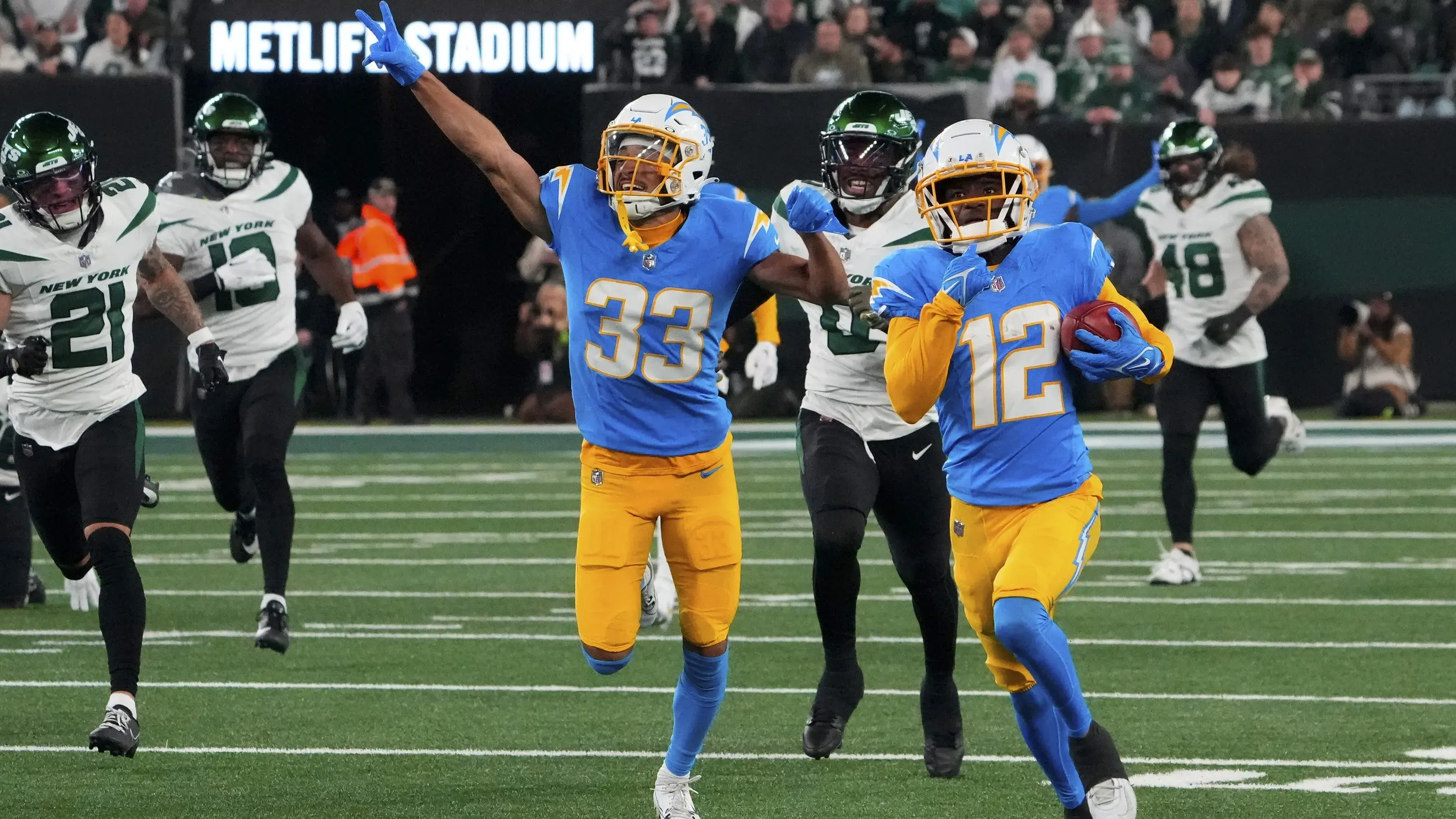 Nov 6, 2023; East Rutherford, New Jersey, USA; Los Angeles Chargers wide receiver Derius Davis (12) runs for a first half touchdown against the New York Jets at MetLife Stadium. Mandatory Credit: Robert Deutsch-USA TODAY Sports / © Robert Deutsch-USA TODAY Sports