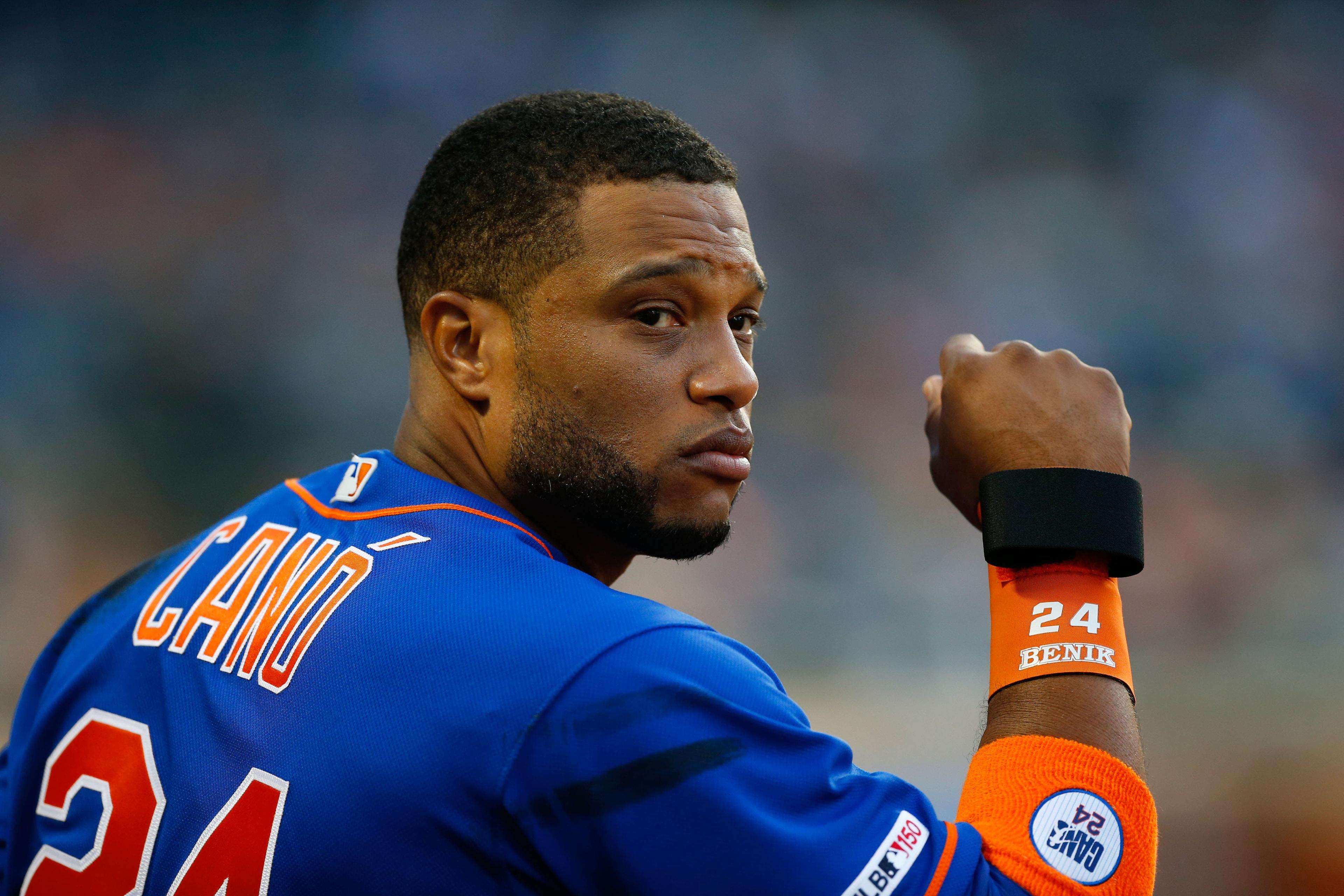 May 21, 2019; New York City, NY, USA; New York Mets second baseman Robinson Cano (24) watches play against the Washington Nationals from the dugout at Citi Field. Mandatory Credit: Noah K. Murray-USA TODAY Sports / Noah K. Murray