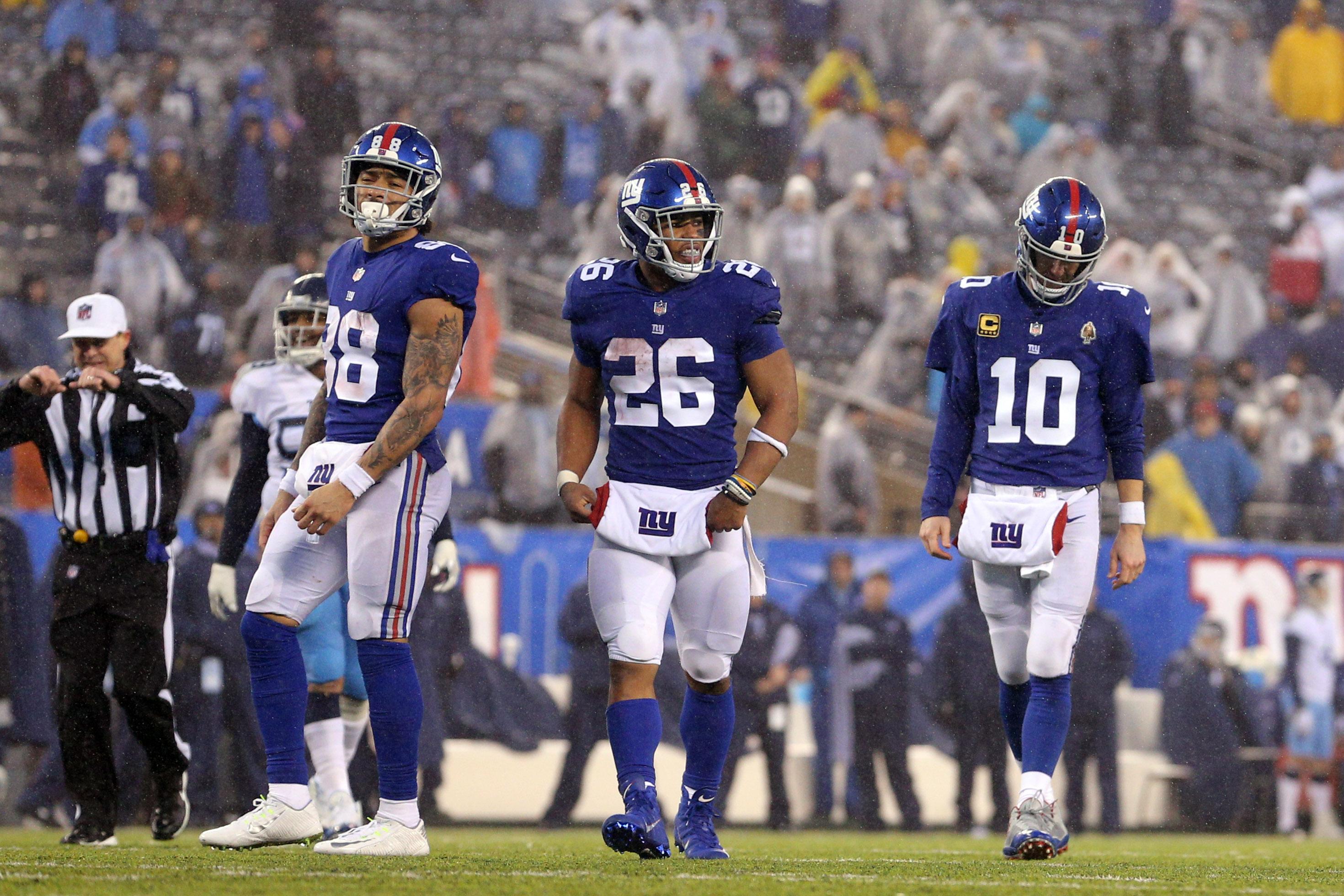 New York Giants tight end Evan Engram, running back Saquon Barkley and quarterback Eli Manning react during the fourth quarter against the Tennessee Titans at MetLife Stadium.