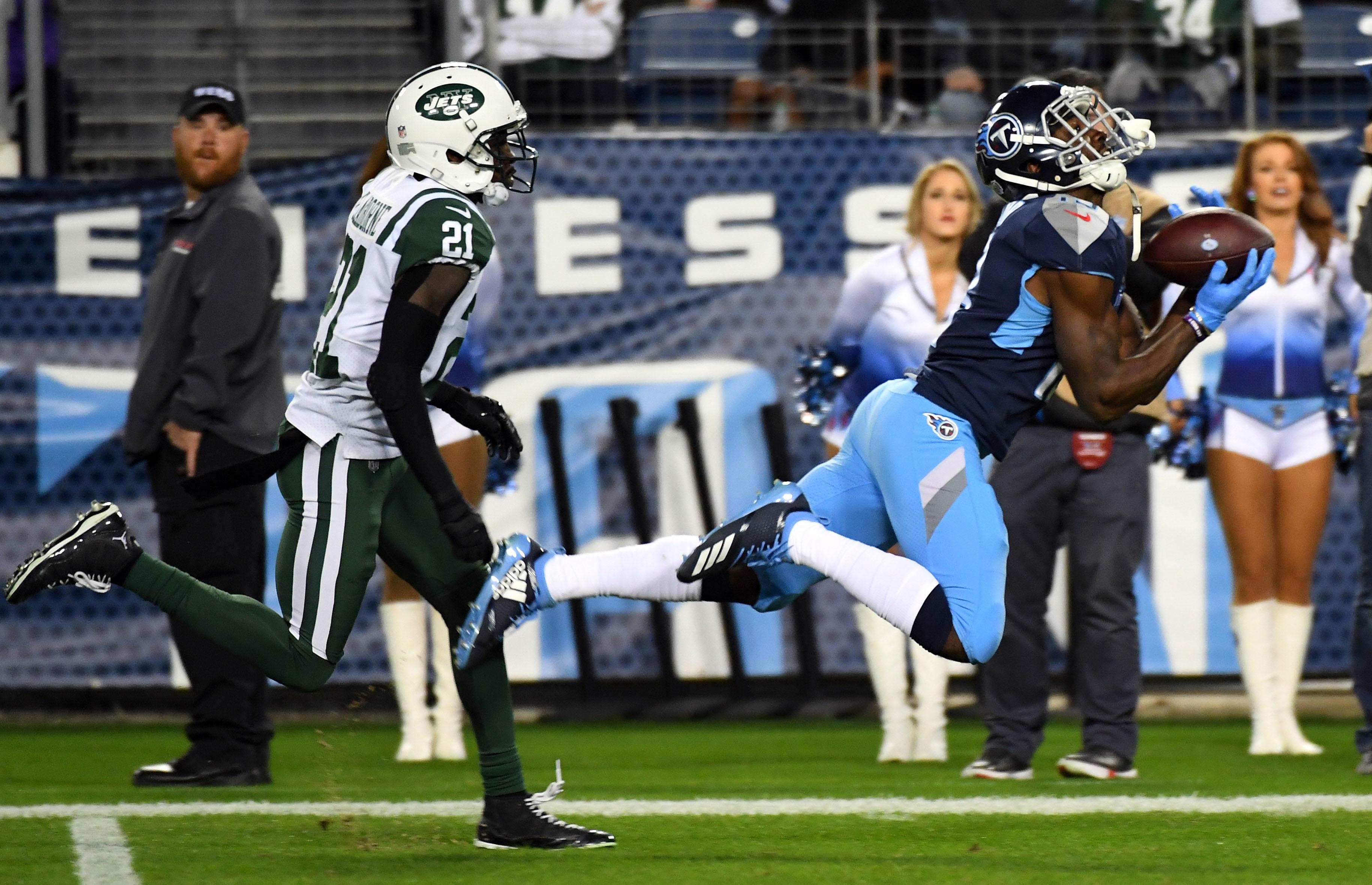 Tennessee Titans wide receiver Taywan Taylor catches a pass in front of coverage by New York Jets cornerback Morris Claiborne during the second half at Nissan Stadium.