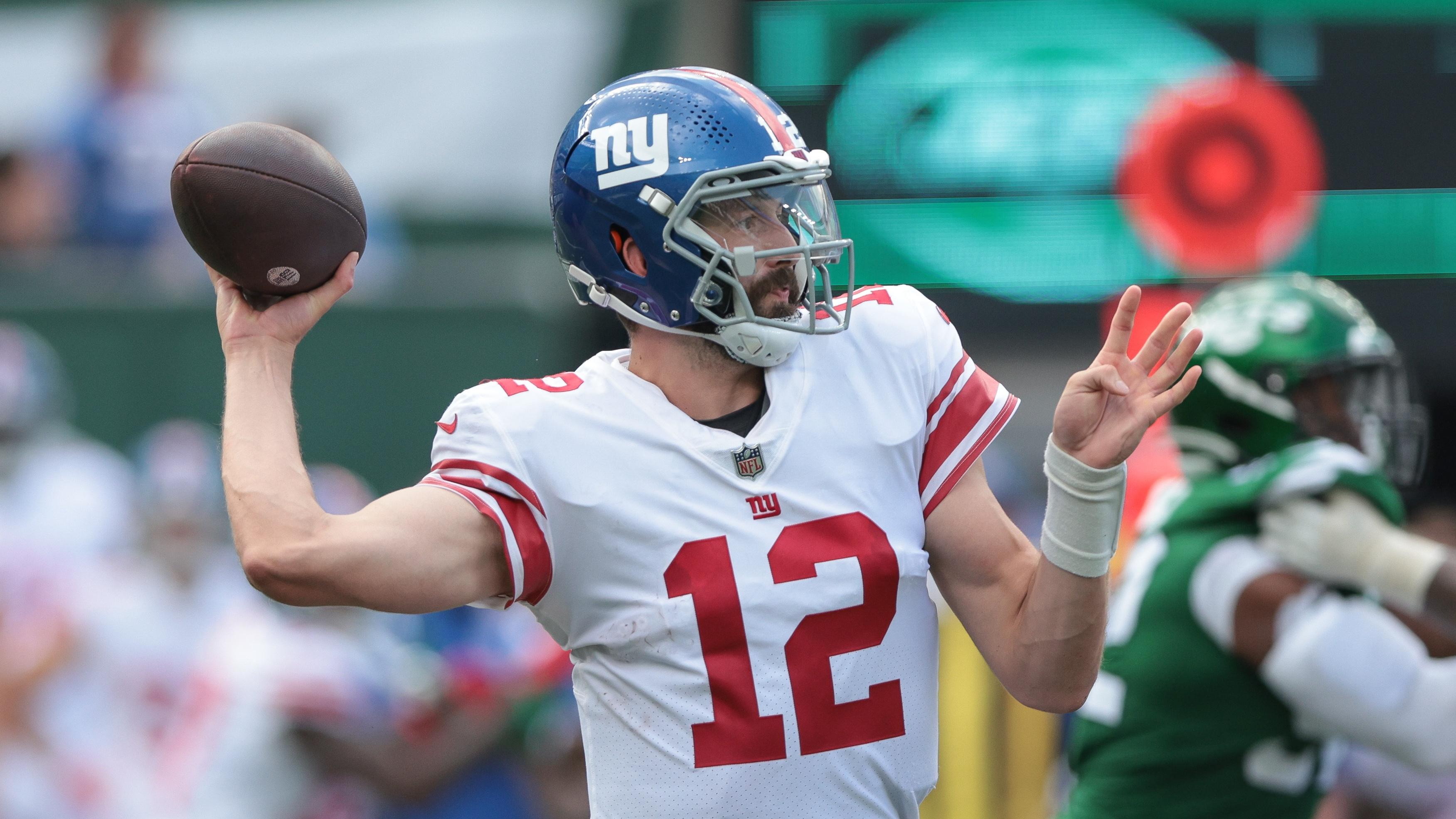 Aug 28, 2022; East Rutherford, New Jersey, USA; New York Giants quarterback Davis Webb (12) throws the ball against the New York Jets during the second half at MetLife Stadium. Mandatory Credit: Vincent Carchietta-USA TODAY Sports