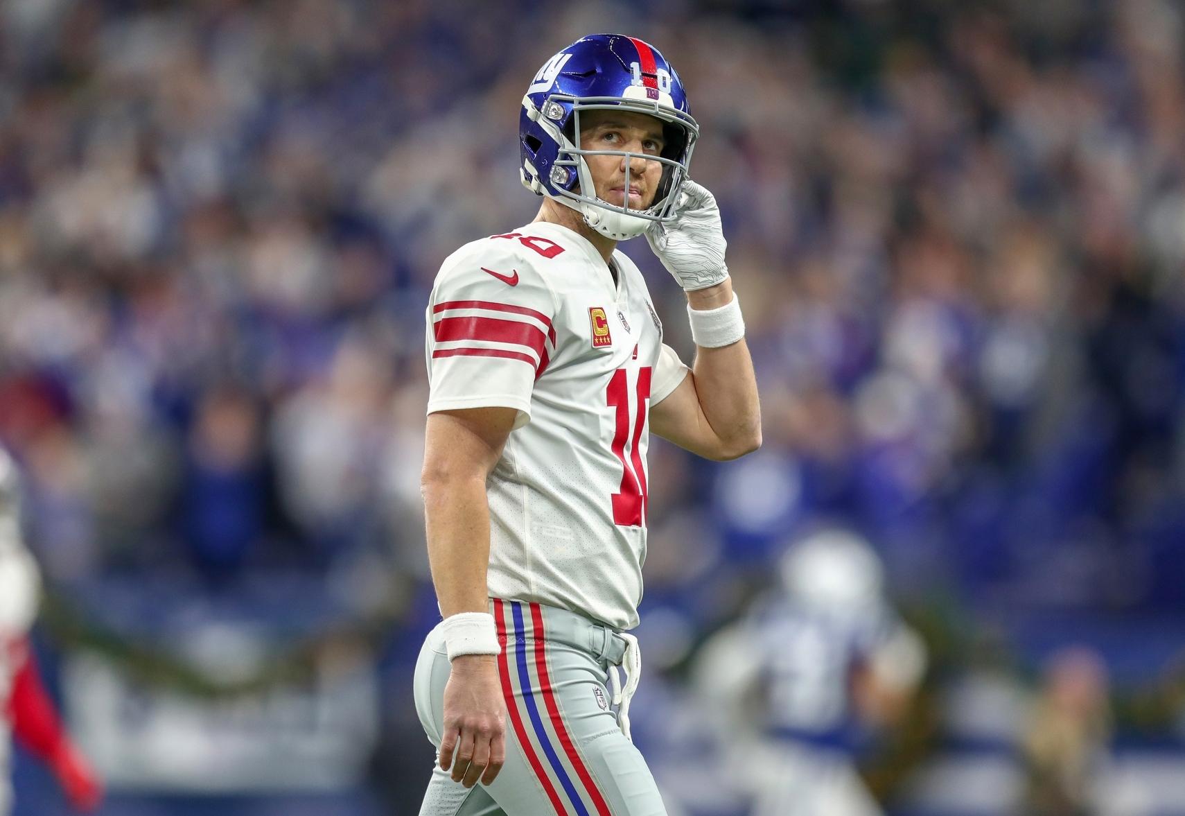 New York Giants quarterback Eli Manning reacts after throwing a interception to Indianapolis Colts free safety Malik Hooker during the second half at Lucas Oil Stadium.