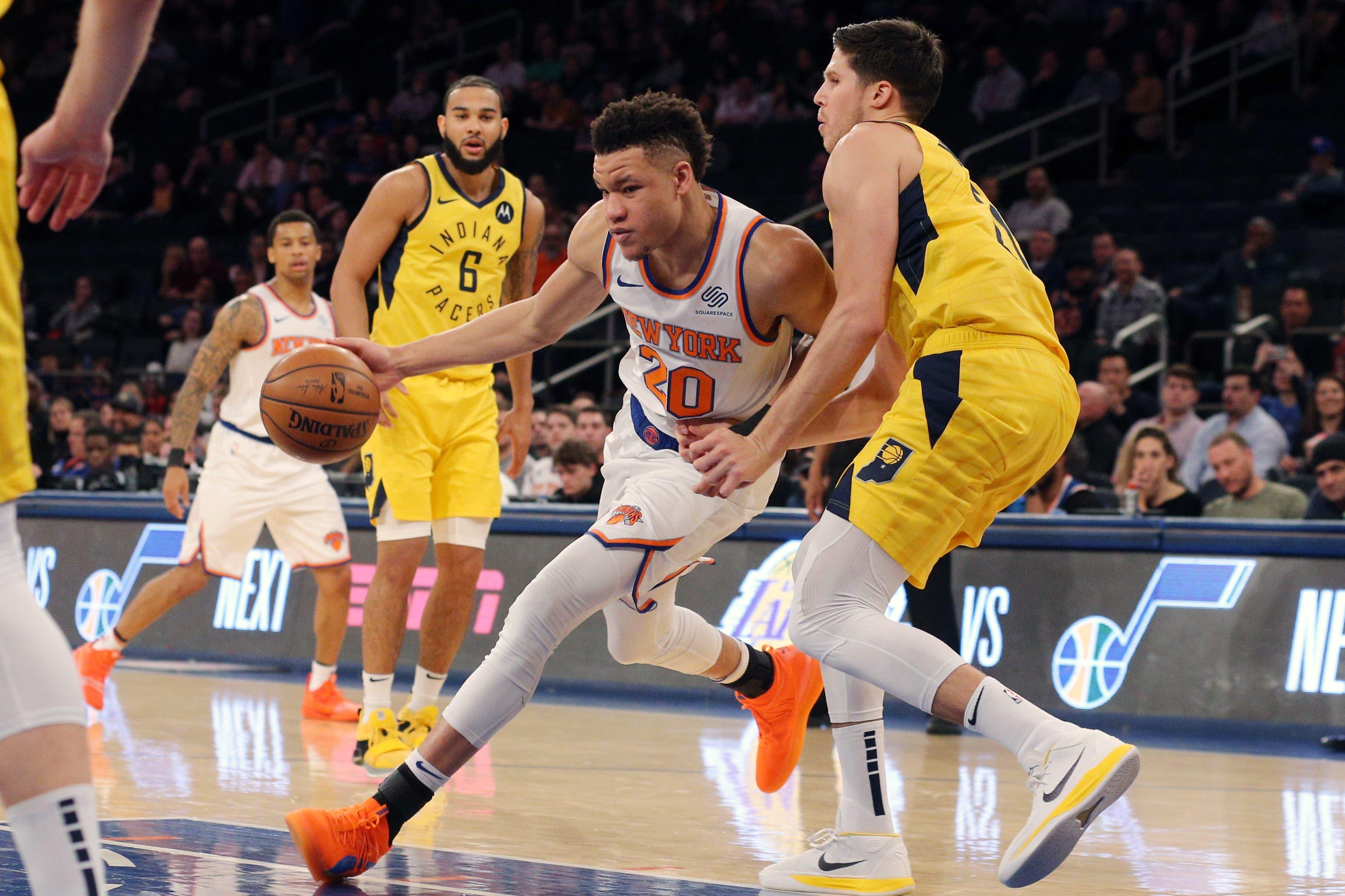 Jan 11, 2019; New York, NY, USA; New York Knicks forward Kevin Knox (20) controls the ball against Indiana Pacers forward Doug McDermott (20) during the fourth quarter at Madison Square Garden. Mandatory Credit: Brad Penner-USA TODAY Sports / Brad Penner