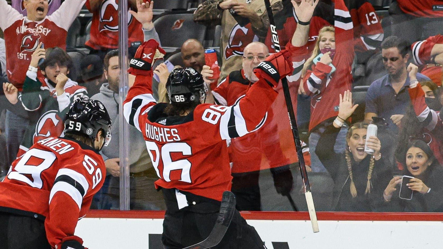 Oct 15, 2021; Newark, New Jersey, USA; New Jersey Devils center Jack Hughes (86) celebrates his goal with center Janne Kuokkanen (59) during the second period against the Chicago Blackhawks at Prudential Center. Mandatory Credit: Vincent Carchietta-USA TODAY Sports / Vincent Carchietta-USA TODAY Sports