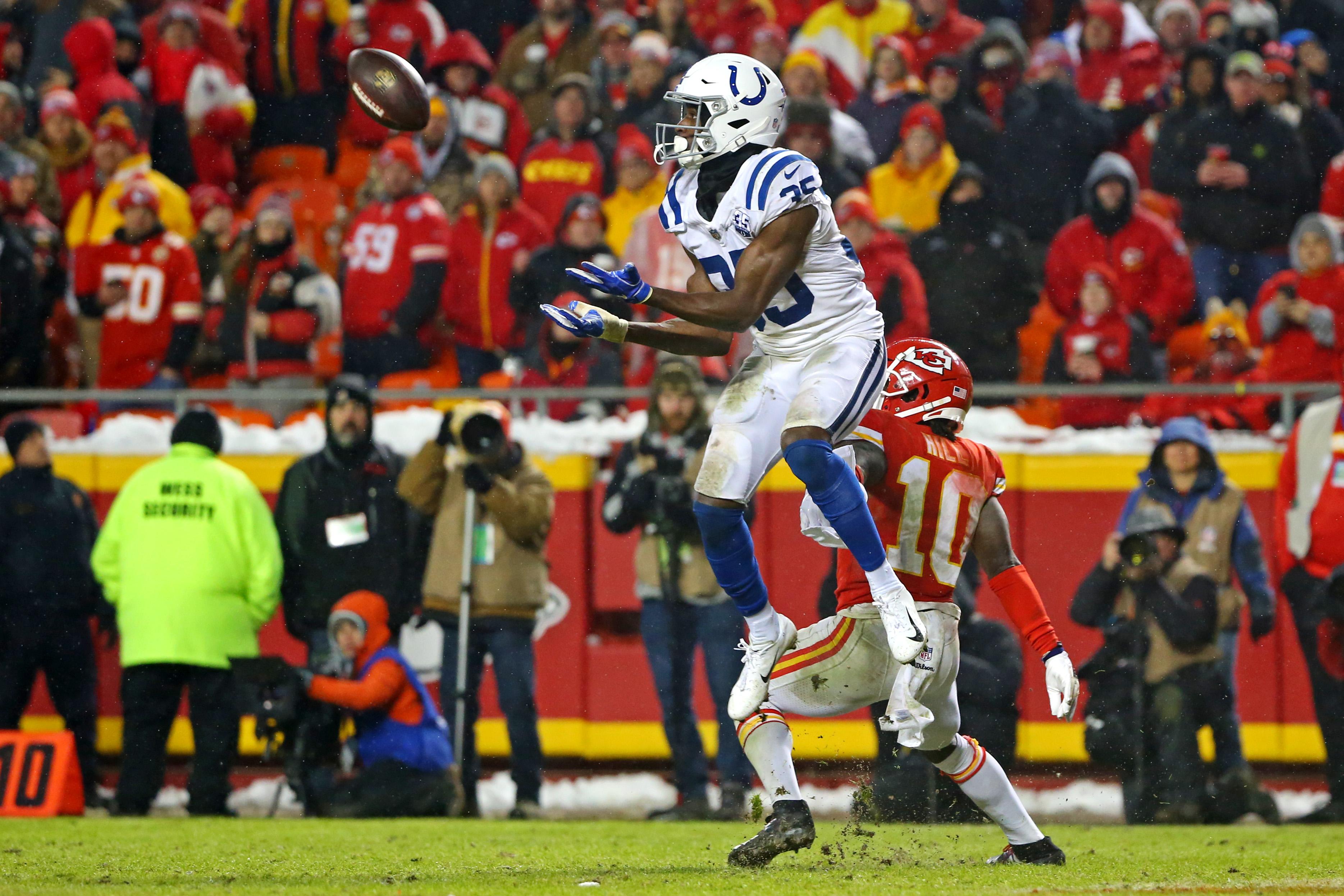 Jan 12, 2019; Kansas City, MO, USA; Indianapolis Colts cornerback Pierre Desir (35) makes an interception on a pass intended for Kansas City Chiefs wide receiver Tyreek Hill (10) during the third quarter in an AFC Divisional playoff football game at Arrowhead Stadium. Mandatory Credit: Jay Biggerstaff-USA TODAY Sports