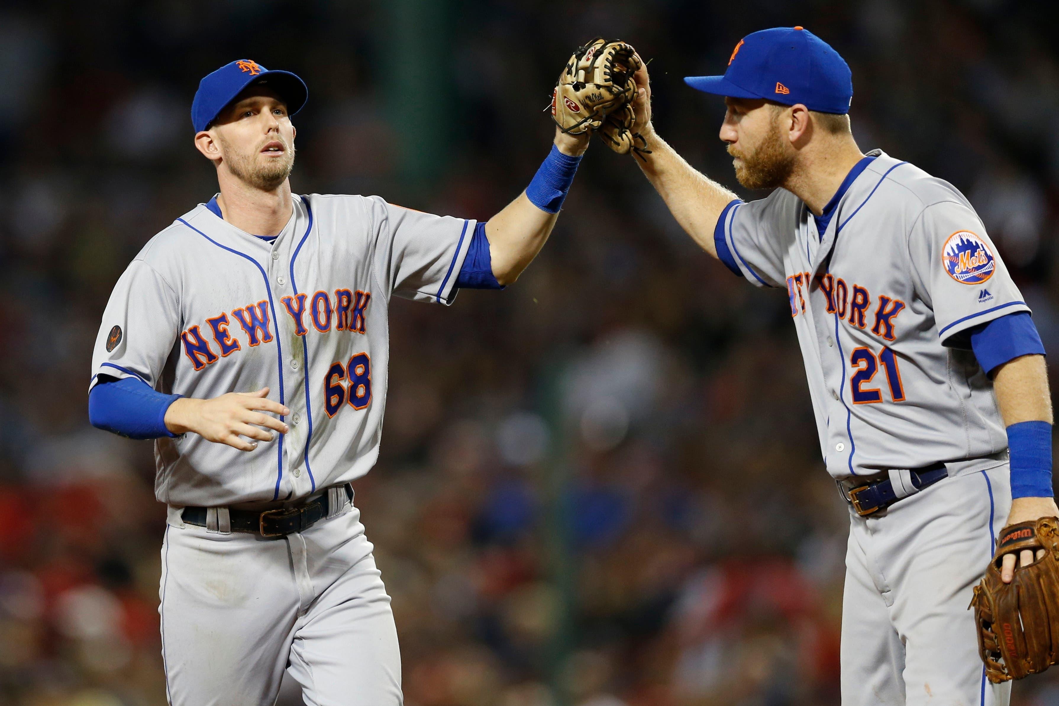 Sep 14, 2018; Boston, MA, USA; New York Mets third baseman Todd Frazier (21) congratulates second baseman Jeff McNeil (68) after catching a line drive hit by center fielder Jackie Bradley Jr. (not pictured) during the seventh inning at Fenway Park. Mandatory Credit: Greg M. Cooper-USA TODAY Sports / Greg M. Cooper