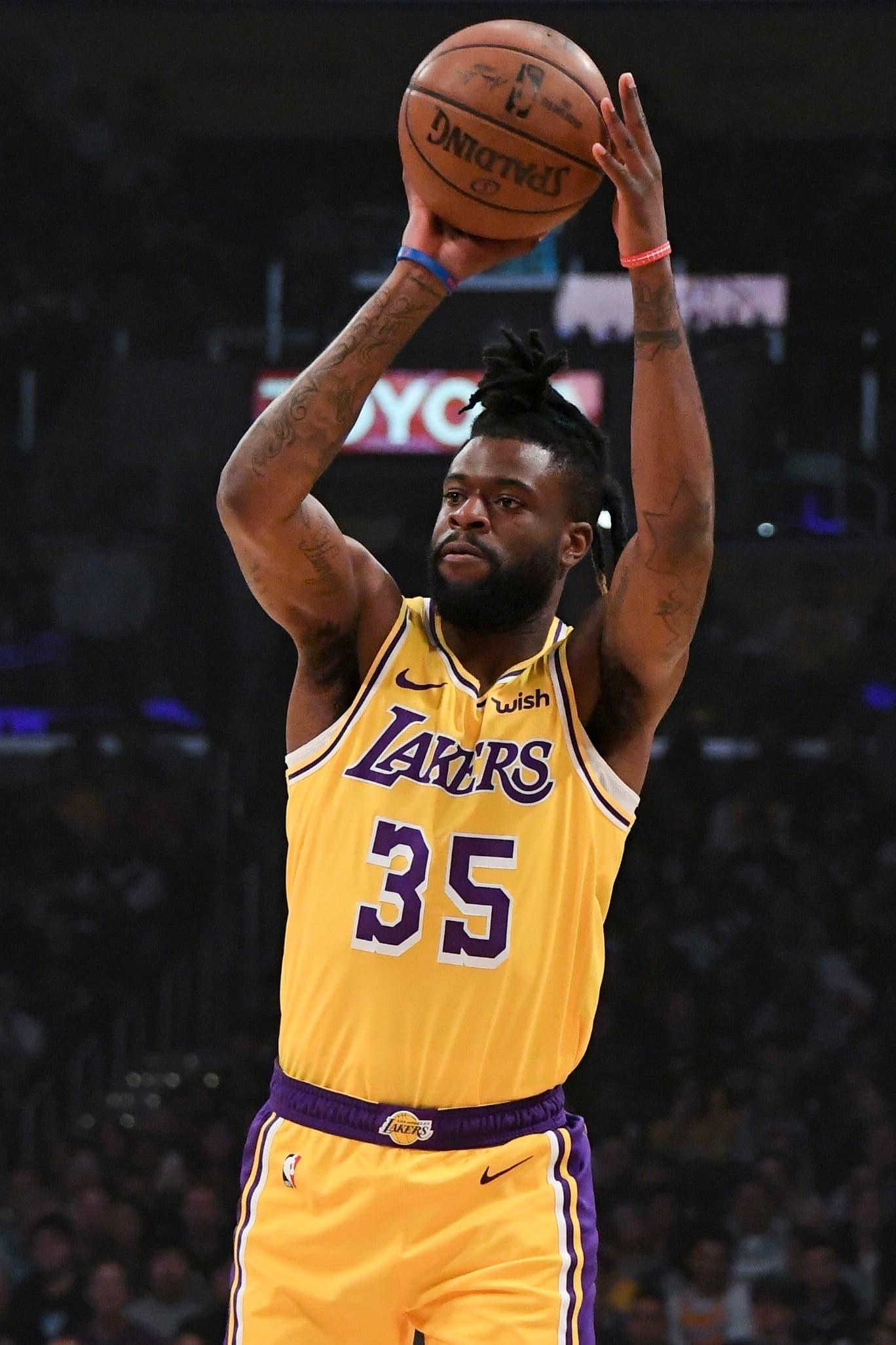 Mar 4, 2019; Los Angeles, CA, USA; Los Angeles Lakers guard Reggie Bullock (35) passes the ball during the first quarter against the Los Angeles Clippers at Staples Center. Mandatory Credit: Richard Mackson-USA TODAY Sports / Richard Mackson