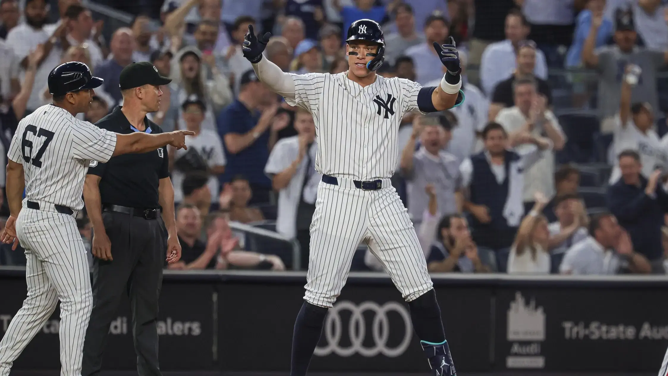 Jun 5, 2024; Bronx, New York, USA; New York Yankees center fielder Aaron Judge (99) reacts after hitting a three RBI triple during the fifth inning against the Minnesota Twins at Yankee Stadium. / Vincent Carchietta-USA TODAY Sports