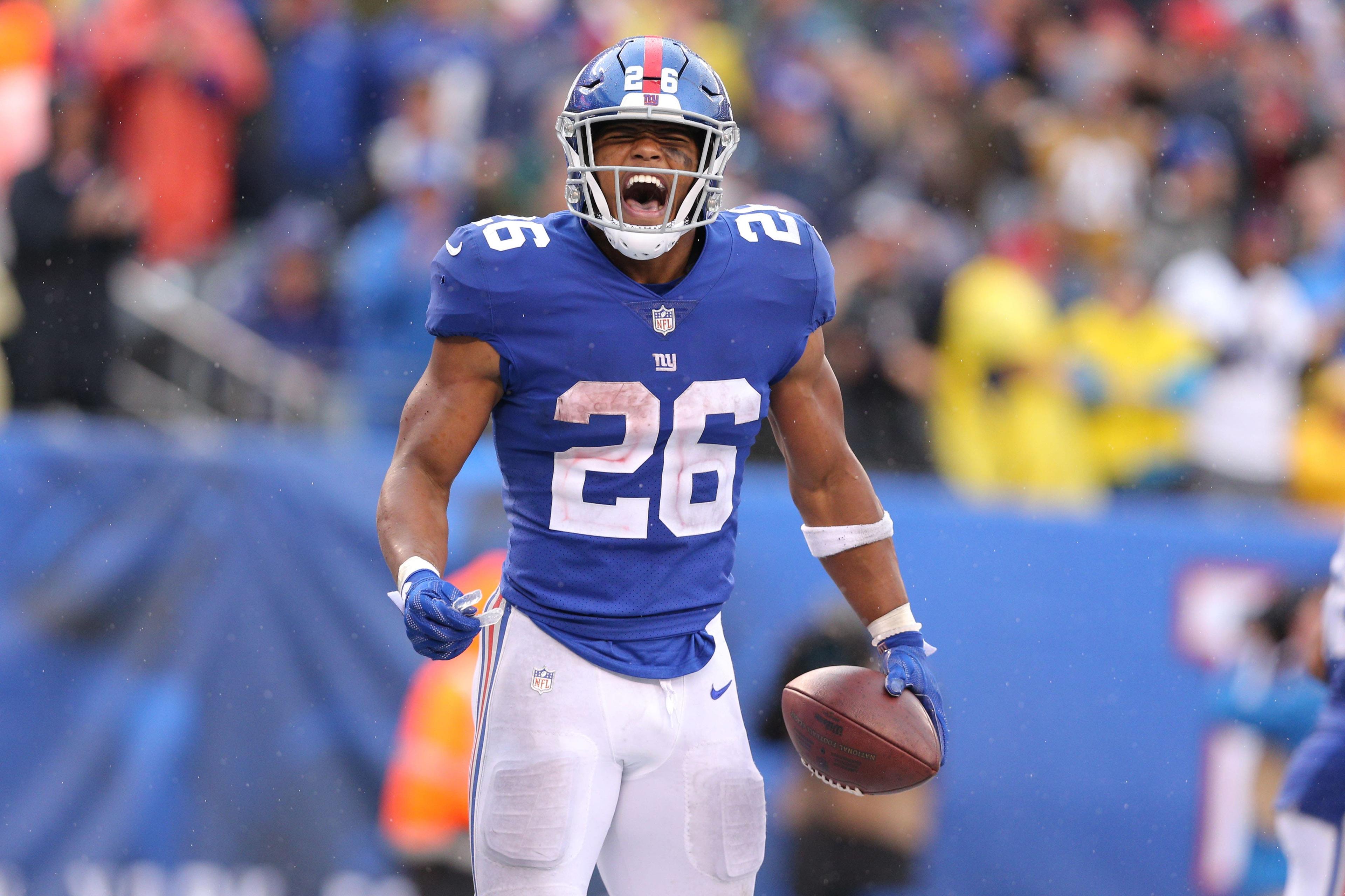 New York Giants running back Saquon Barkley celebrates his touchdown against the Jacksonville Jaguars during the fourth quarter at MetLife Stadium. / Brad Penner/USA TODAY Sports