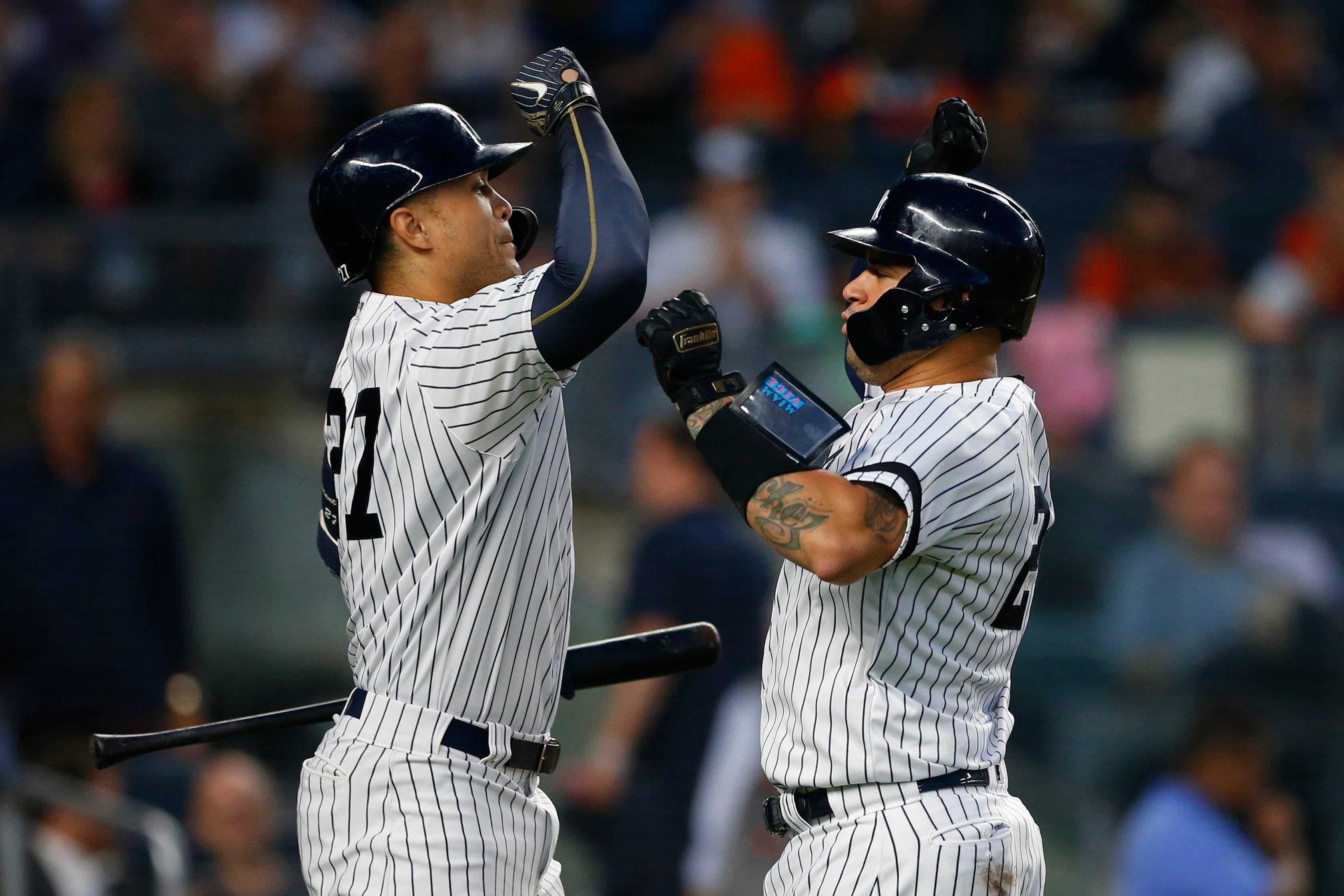 Jun 20, 2019; Bronx, NY, USA; New York Yankees catcher Gary Sanchez (24) celebrates with right fielder Giancarlo Stanton (27) after hitting a home run in the fourth inning against the Houston Astros at Yankee Stadium. Mandatory Credit: Noah K. Murray-USA TODAY Sports / Noah K. Murray