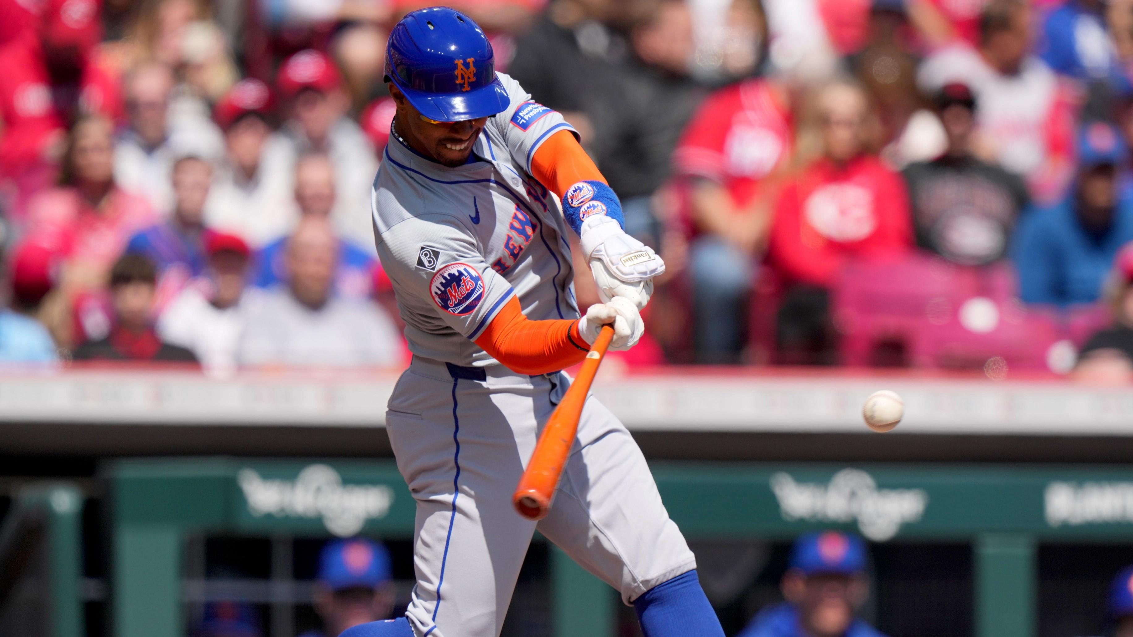New York Mets shortstop Francisco Lindor (12) hits a double in the first inning of an MLB baseball game against the Cincinnati Reds, Sunday, April 7, 2024, at Great American Ball Park in Cincinnati. / Kareem Elgazzar/The Enquirer / USA TODAY NETWORK