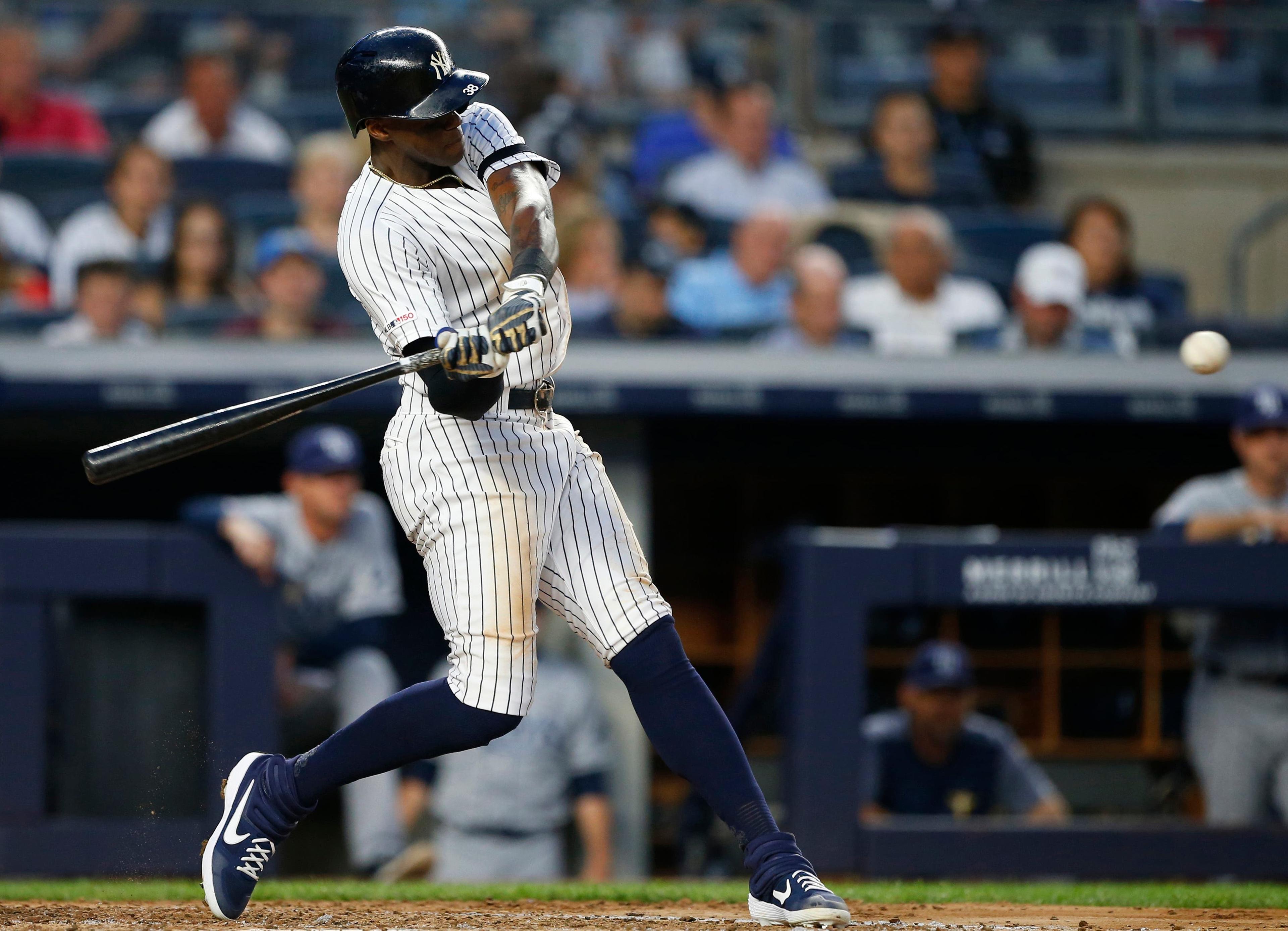 Jun 17, 2019; Bronx, NY, USA; New York Yankees left fielder Cameron Maybin (38) hits a home run against the Tampa Bay Rays in the fifth inning at Yankee Stadium. Mandatory Credit: Noah K. Murray-USA TODAY Sports / Noah K. Murray