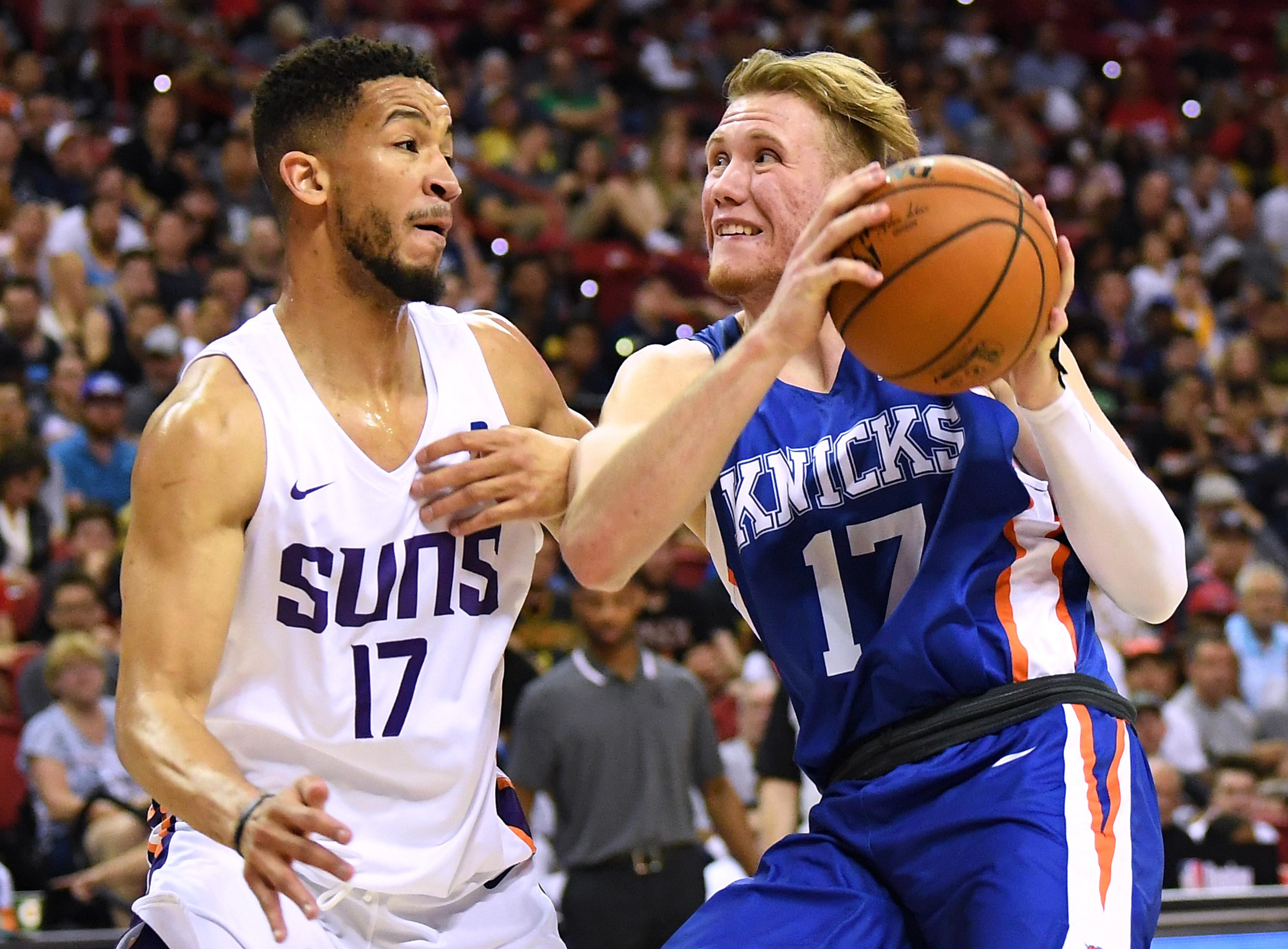 Jul 7, 2019; Las Vegas, NV, USA; New York Knicks forward Ignas Brazdeikis (17) drives against Phoenix Suns guard Billy Garrett Jr (17) during the second half of an NBA Summer League game at Thomas & Mack Center. Mandatory Credit: Stephen R. Sylvanie-USA TODAY Sports