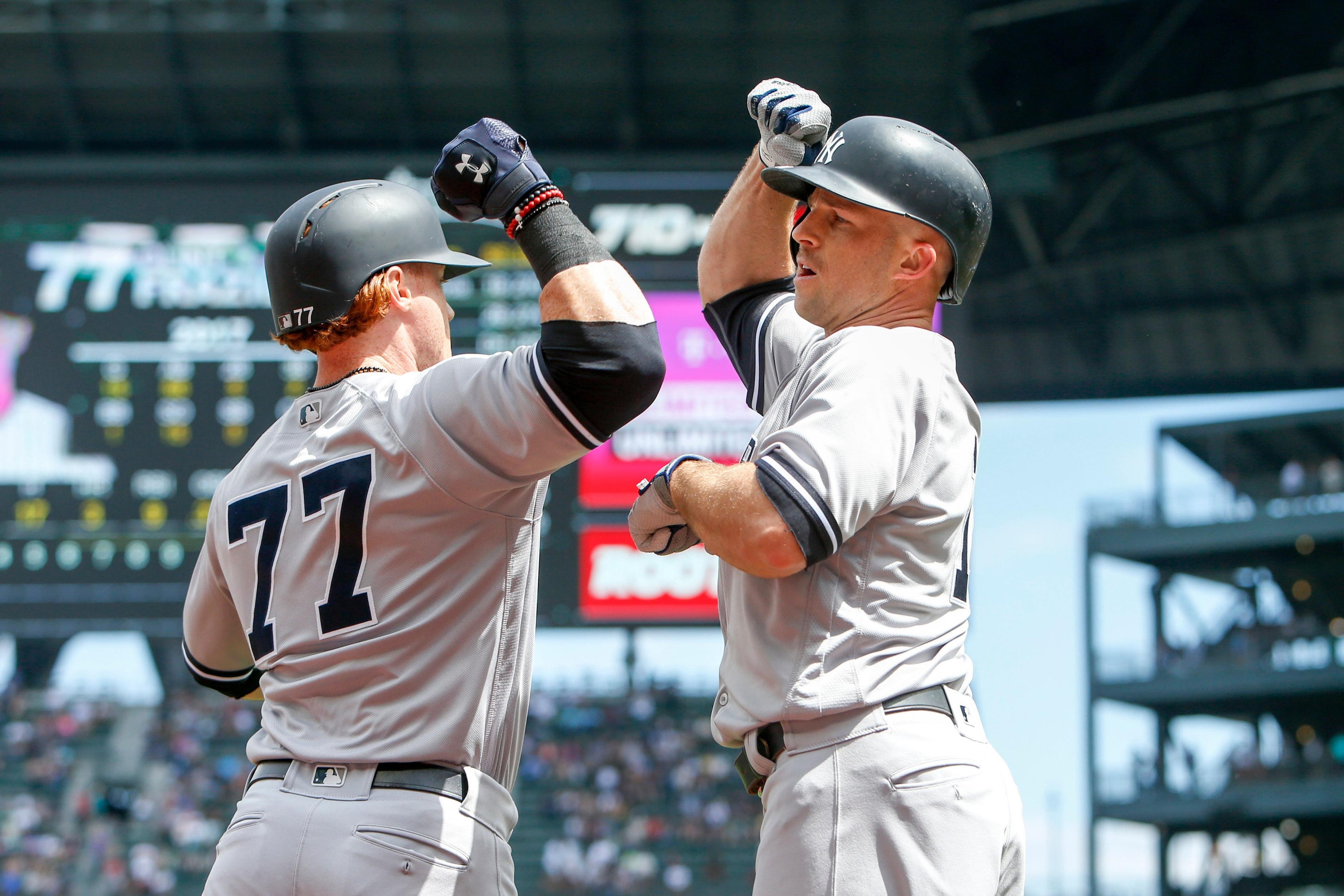 Jul 23, 2017; Seattle, WA, USA; New York Yankees center fielder Brett Gardner (11) is greeted by left fielder Clint Frazier (77) following a solo-home run by Gardner during the first inning at Safeco Field. Mandatory Credit: Joe Nicholson-USA TODAY Sports / Joe Nicholson