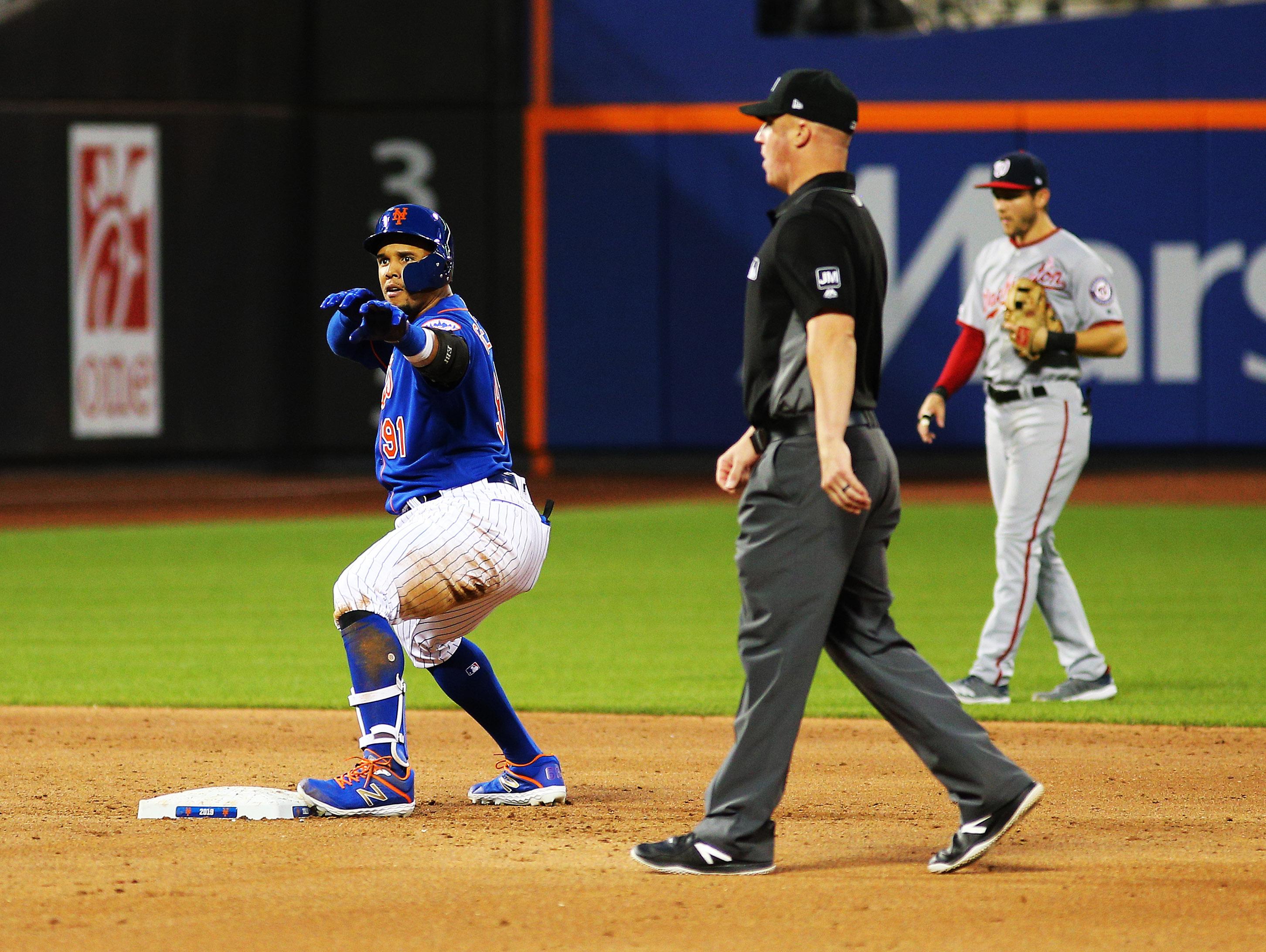 New York Mets right fielder Carlos Gomez reacts after hitting an RBI double against the Washington Nationals during the third inning at Citi Field.