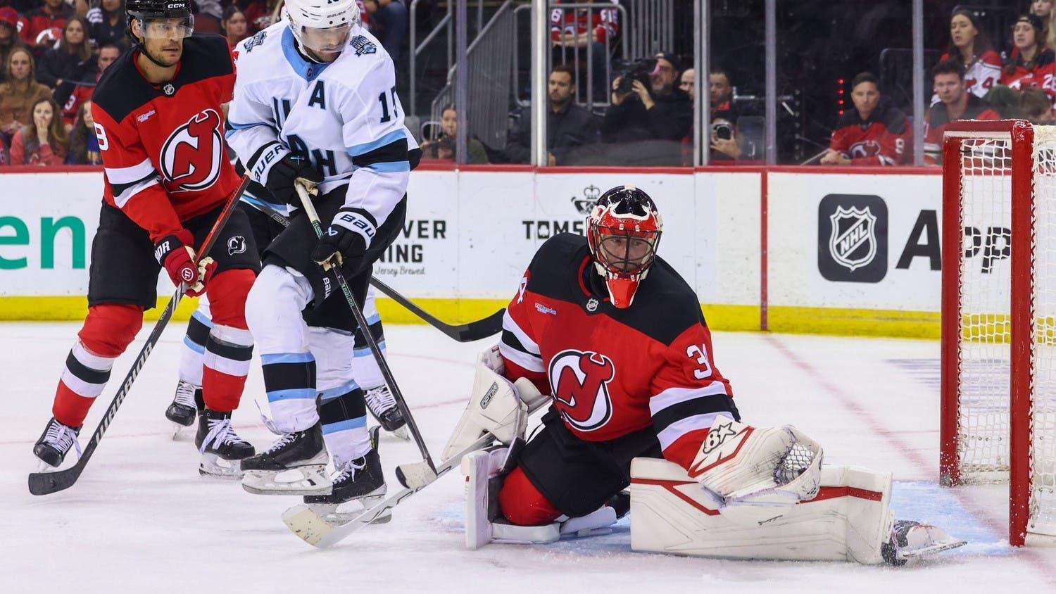 Oct 14, 2024; Newark, New Jersey, USA; New Jersey Devils goaltender Jake Allen (34) makes a save against the Utah Hockey Club during the third period at Prudential Center. / Ed Mulholland-Imagn Images