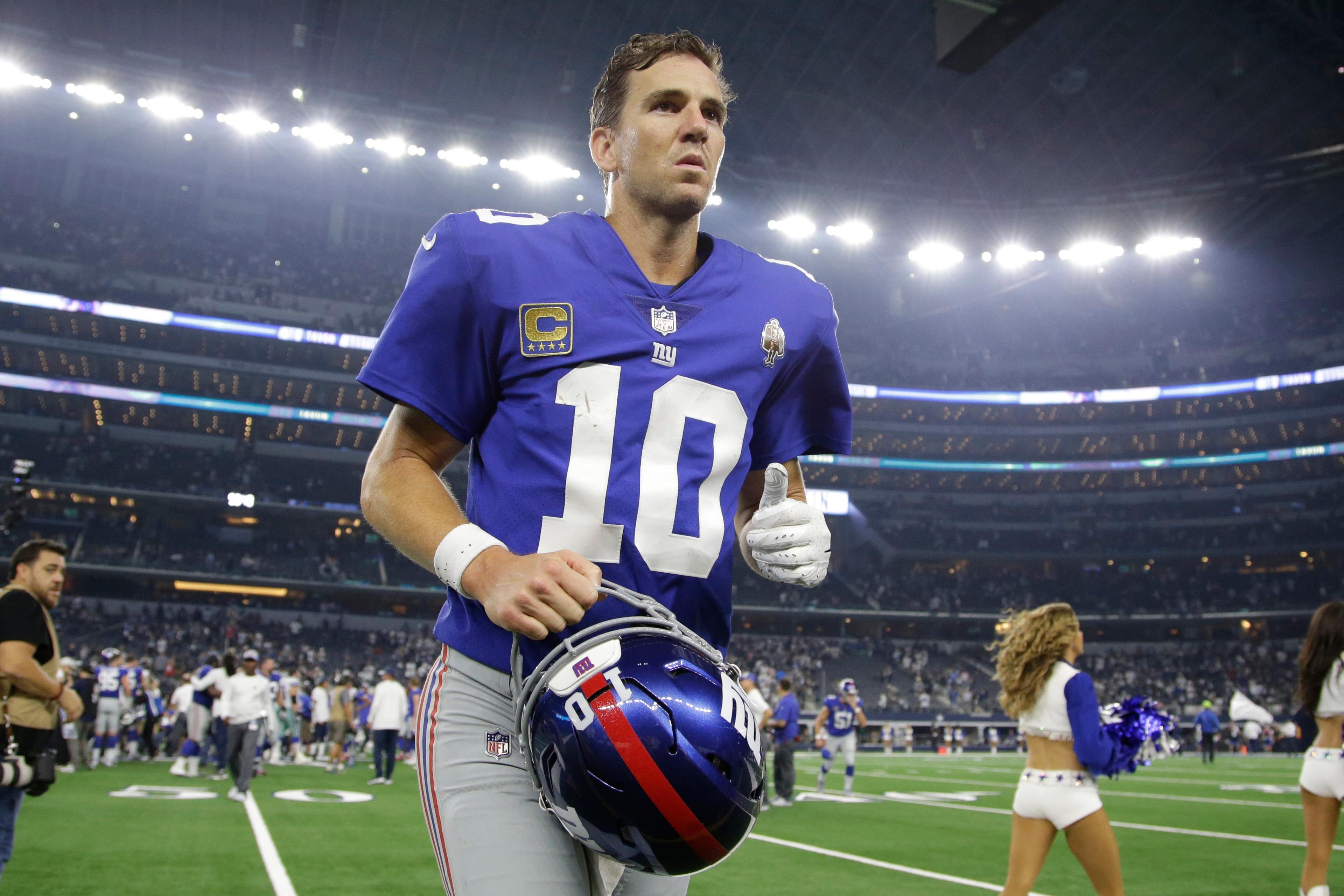 Sep 16, 2018; Arlington, TX, USA; New York Giants quarterback Eli Manning (10) leaves the field after the game against the Dallas Cowboys at AT&T Stadium. Mandatory Credit: Tim Heitman-USA TODAY Sports / Tim Heitman