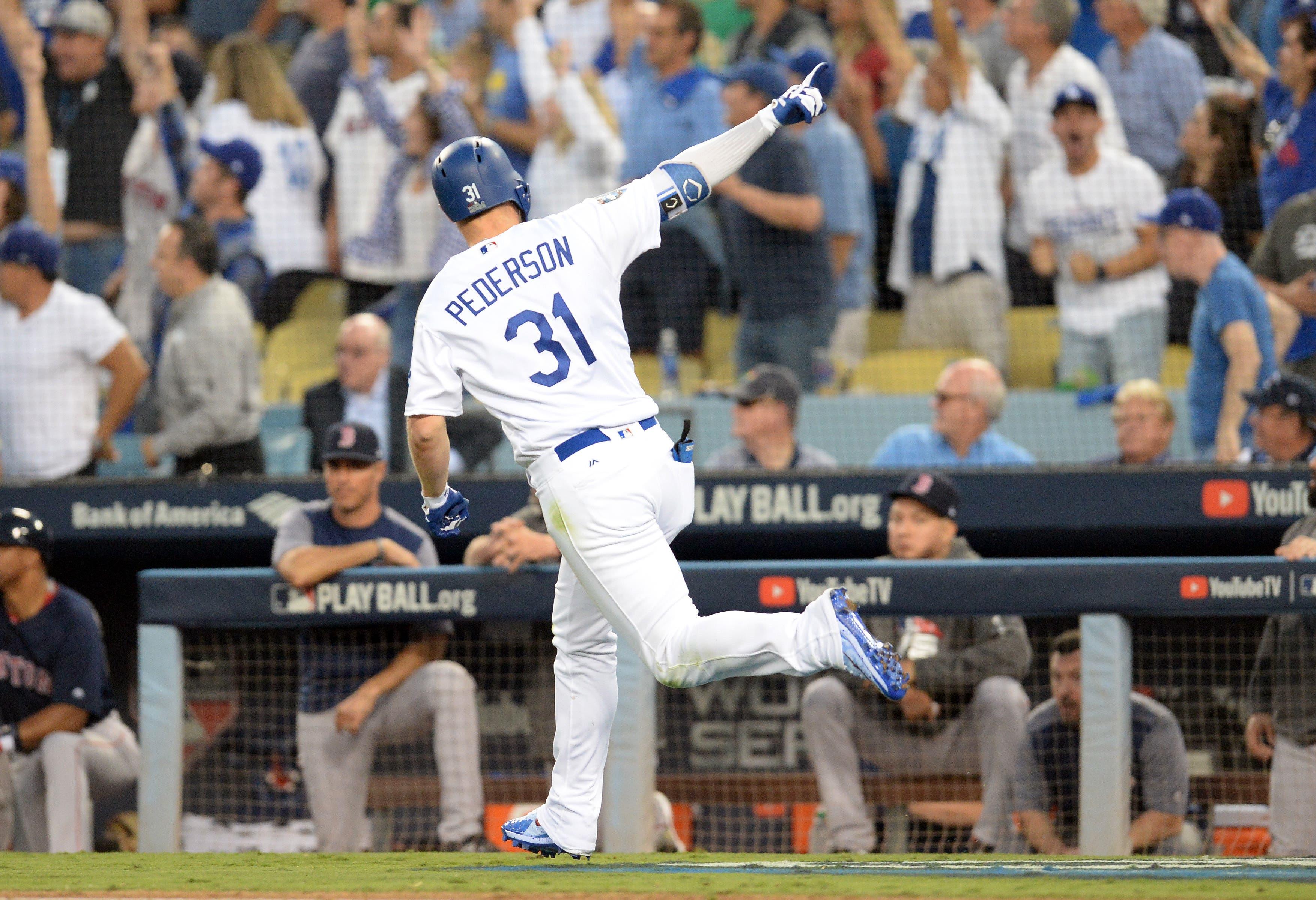 Oct 26, 2018; Los Angeles, CA, USA; Los Angeles Dodgers outfielder Joc Pederson (31) celebrates after hitting a solo home run against the Boston Red Sox in the third inning in game three of the 2018 World Series at Dodger Stadium. Mandatory Credit: Gary A. Vasquez-USA TODAY Sports / Gary A. Vasquez