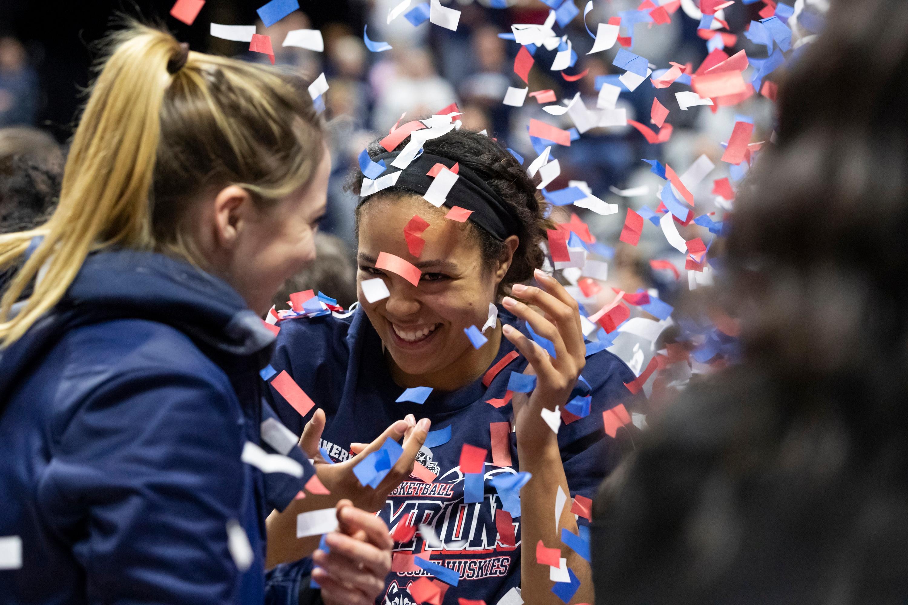 UConn Huskies forward Napheesa Collier and guard Katie Lou Samuelson celebrate after their championship victory against the UCF Knights in the women's American Conference Tournament at Mohegan Sun Arena.