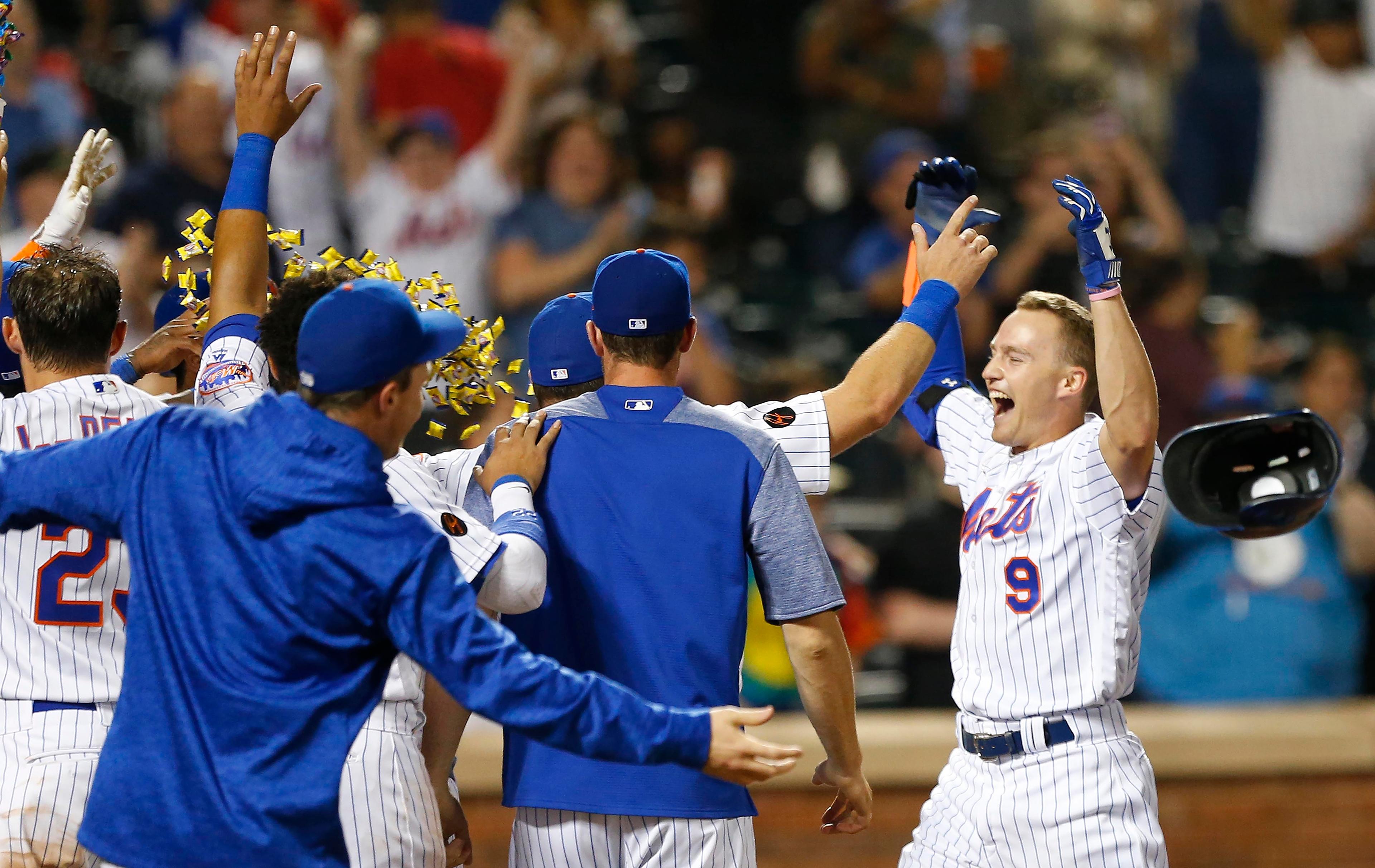 Jul 11, 2018; New York City, NY, USA; New York Mets center fielder Brandon Nimmo (9) celebrate after hitting a three run home run in the tenth inning to defeat the Philadelphia Phillies 3-0 at Citi Field. Mandatory Credit: Noah K. Murray-USA TODAY Sports