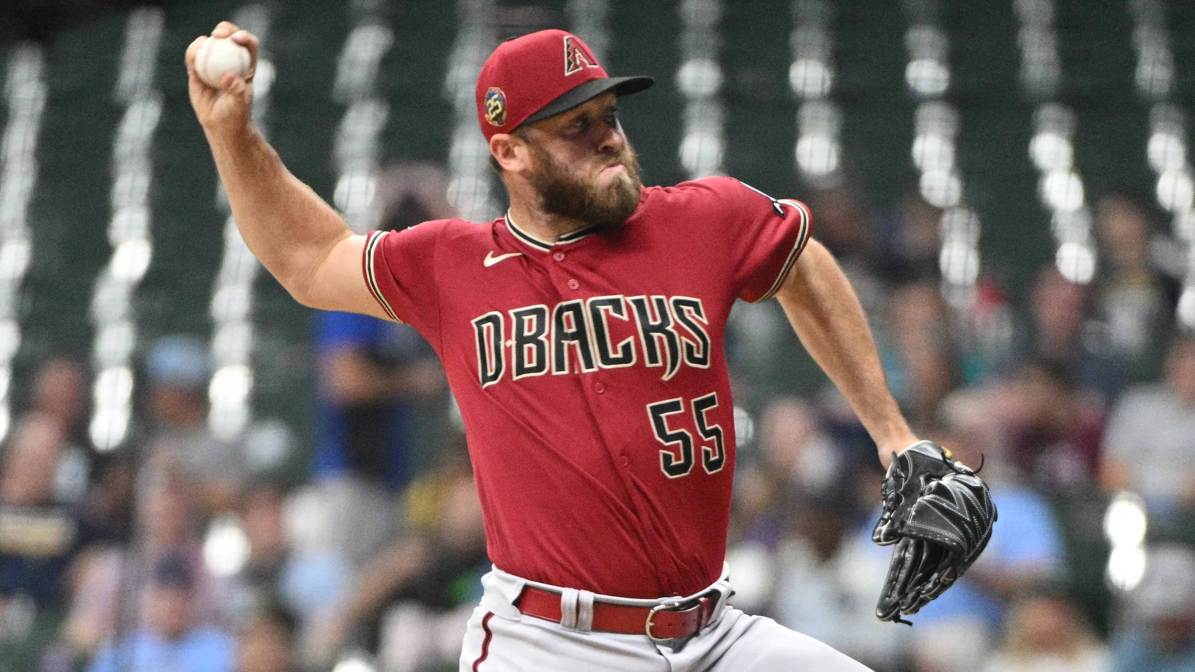 Arizona Diamondbacks relief pitcher Austin Adams (55) delivers a pitch against the Milwaukee Brewers in the sixth inning at American Family Field / Michael McLoone - USA TODAY Sports
