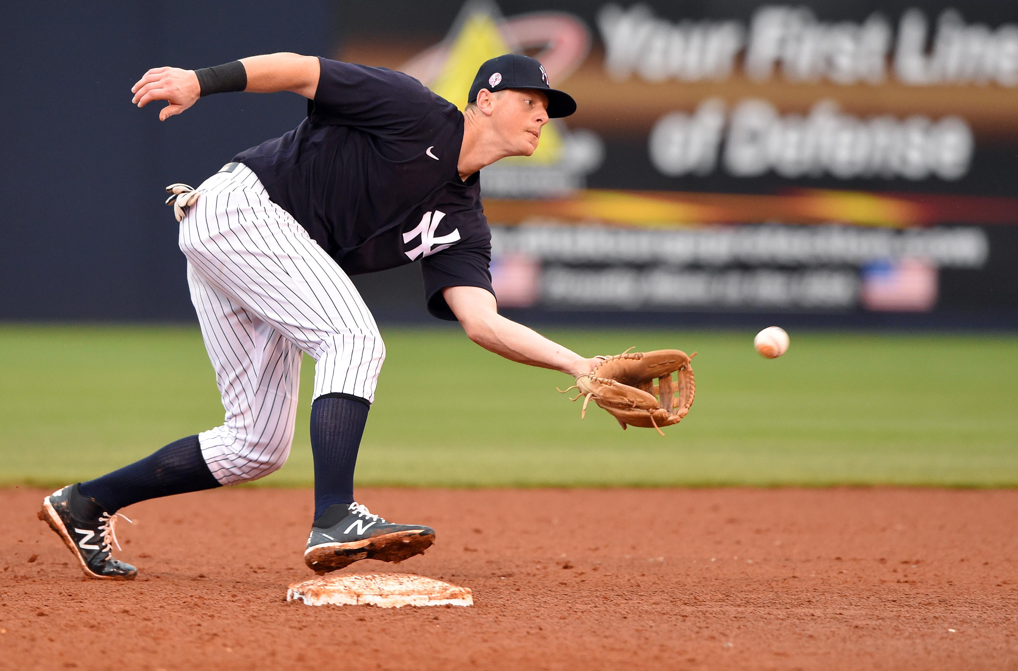 Feb 26, 2020; Tampa, Florida, USA; New York Yankees second baseman DJ LeMahieu (26) fields a ball against the Washington Nationals during the fifth inning at George M. Steinbrenner Field. Mandatory Credit: John David Mercer-USA TODAY Sports