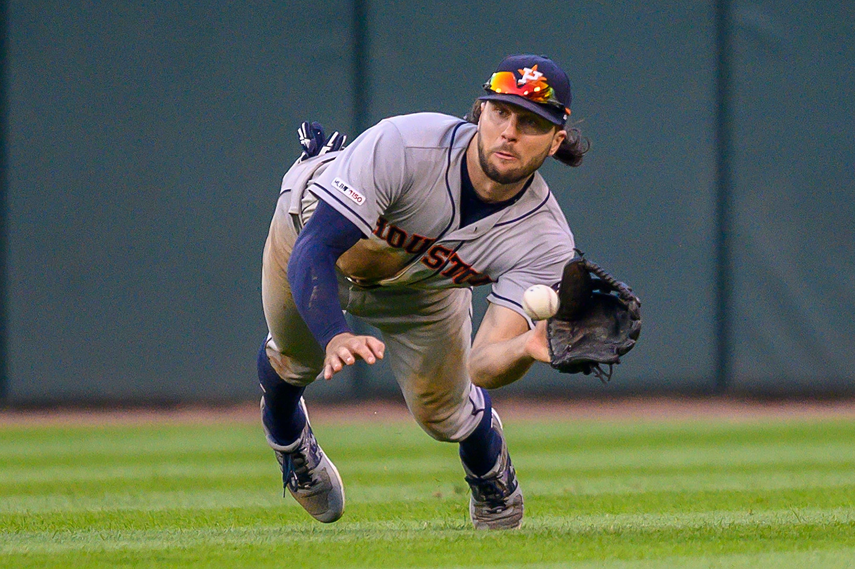 Aug 13, 2019; Chicago, IL, USA; Houston Astros center fielder Jake Marisnick (6) dives to catch Chicago White Sox left fielder Eloy Jimenez's fly ball during the ninth inning in game one of a baseball doubleheader at Guaranteed Rate Field. Mandatory Credit: Patrick Gorski-USA TODAY Sports / Patrick Gorski