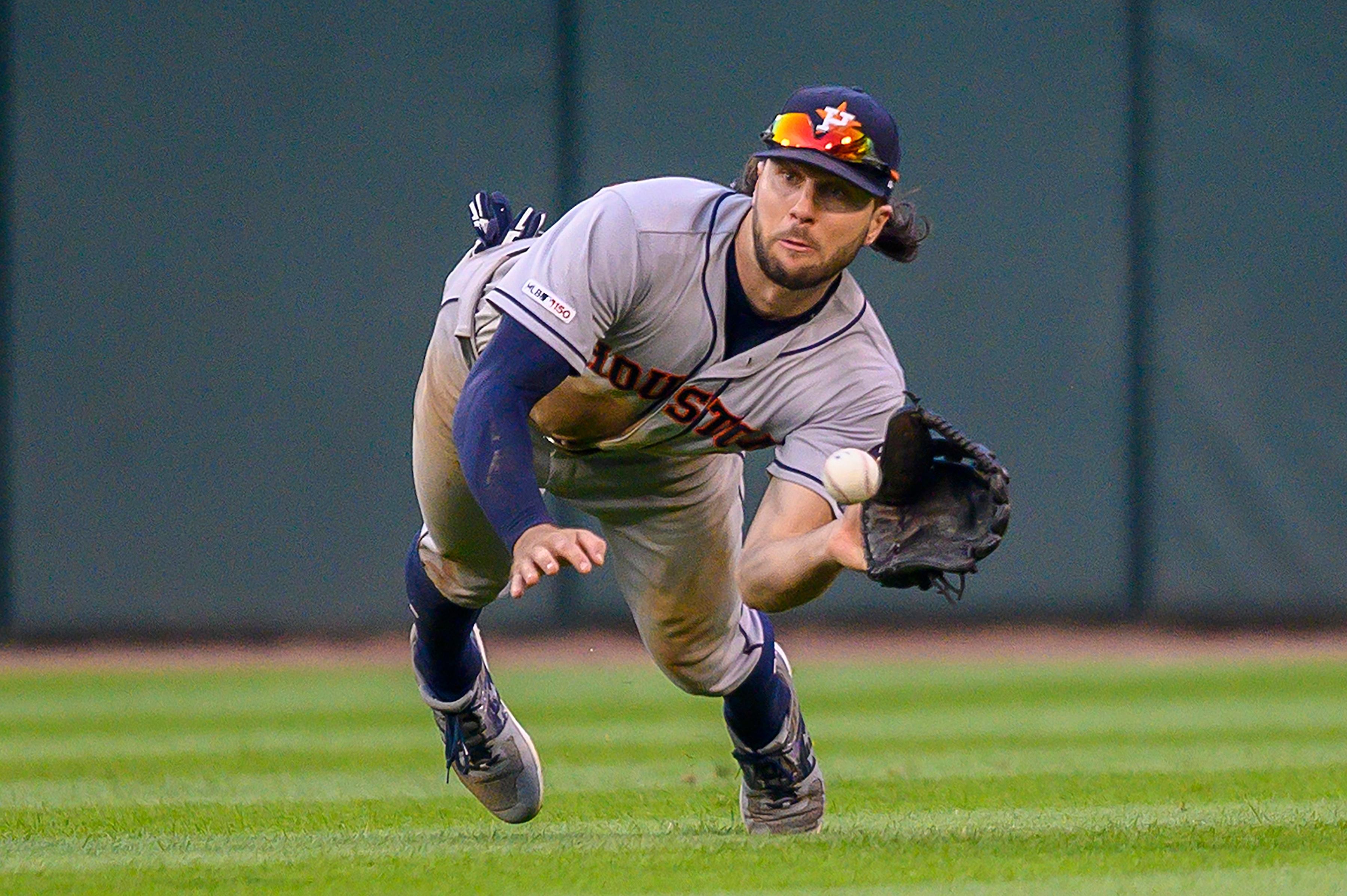 Aug 13, 2019; Chicago, IL, USA; Houston Astros center fielder Jake Marisnick (6) dives to catch Chicago White Sox left fielder Eloy Jimenez's fly ball during the ninth inning in game one of a baseball doubleheader at Guaranteed Rate Field. Mandatory Credit: Patrick Gorski-USA TODAY Sports