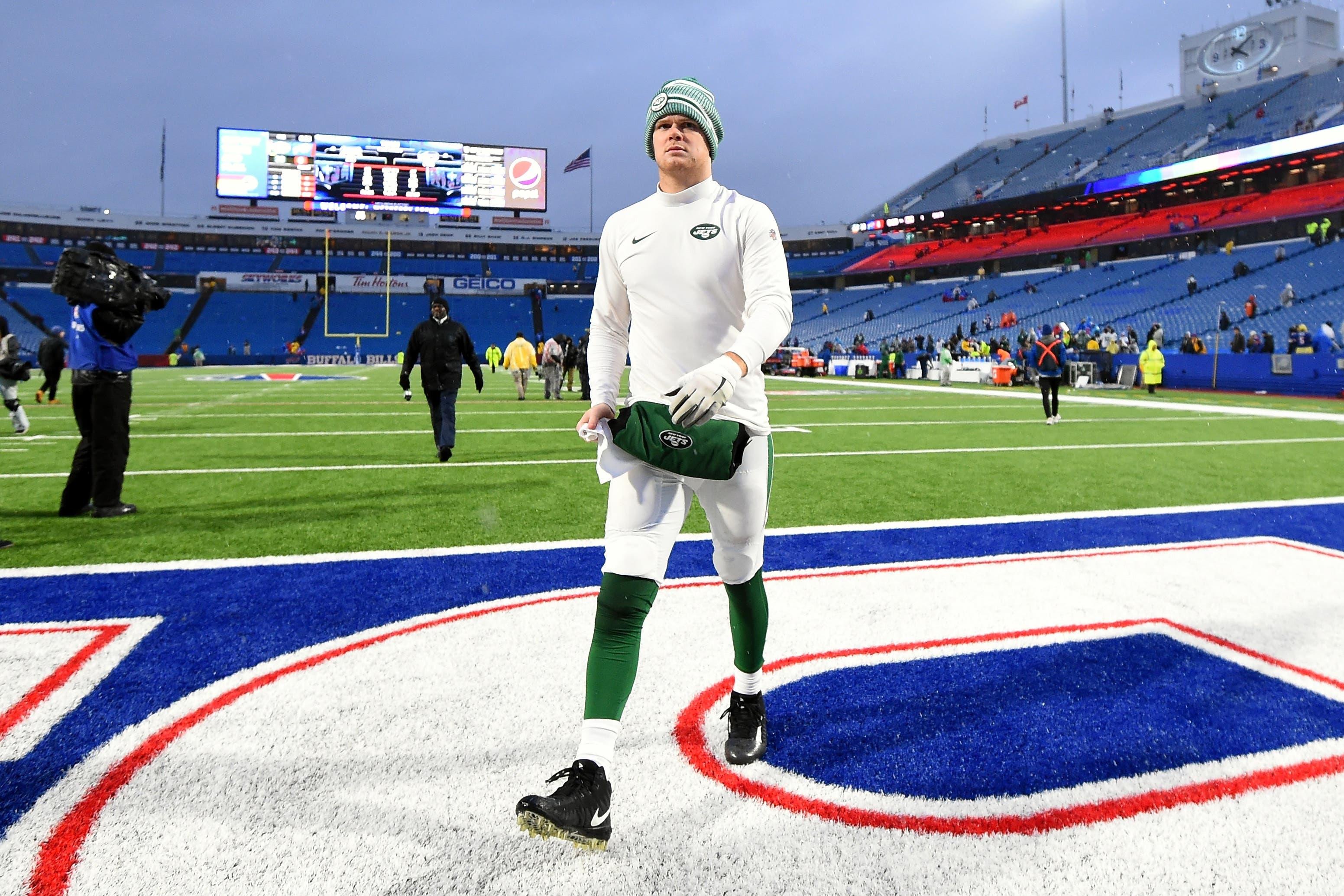 Sam Darnold walks off the field in Buffalo / USA TODAY