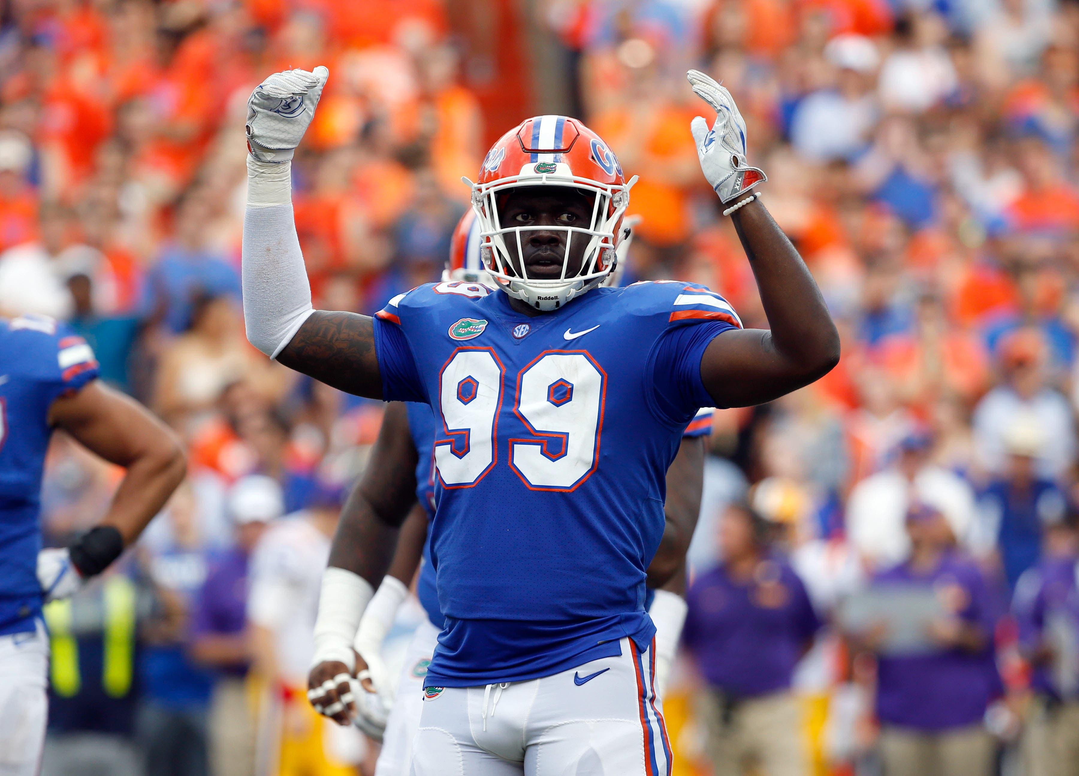 Oct 7, 2017; Gainesville, FL, USA;Florida Gators defensive lineman Jachai Polite (99) gets the fans pumped up against the LSU Tigers during the first half at Ben Hill Griffin Stadium. Mandatory Credit: Kim Klement-USA TODAY Sports / Kim Klement