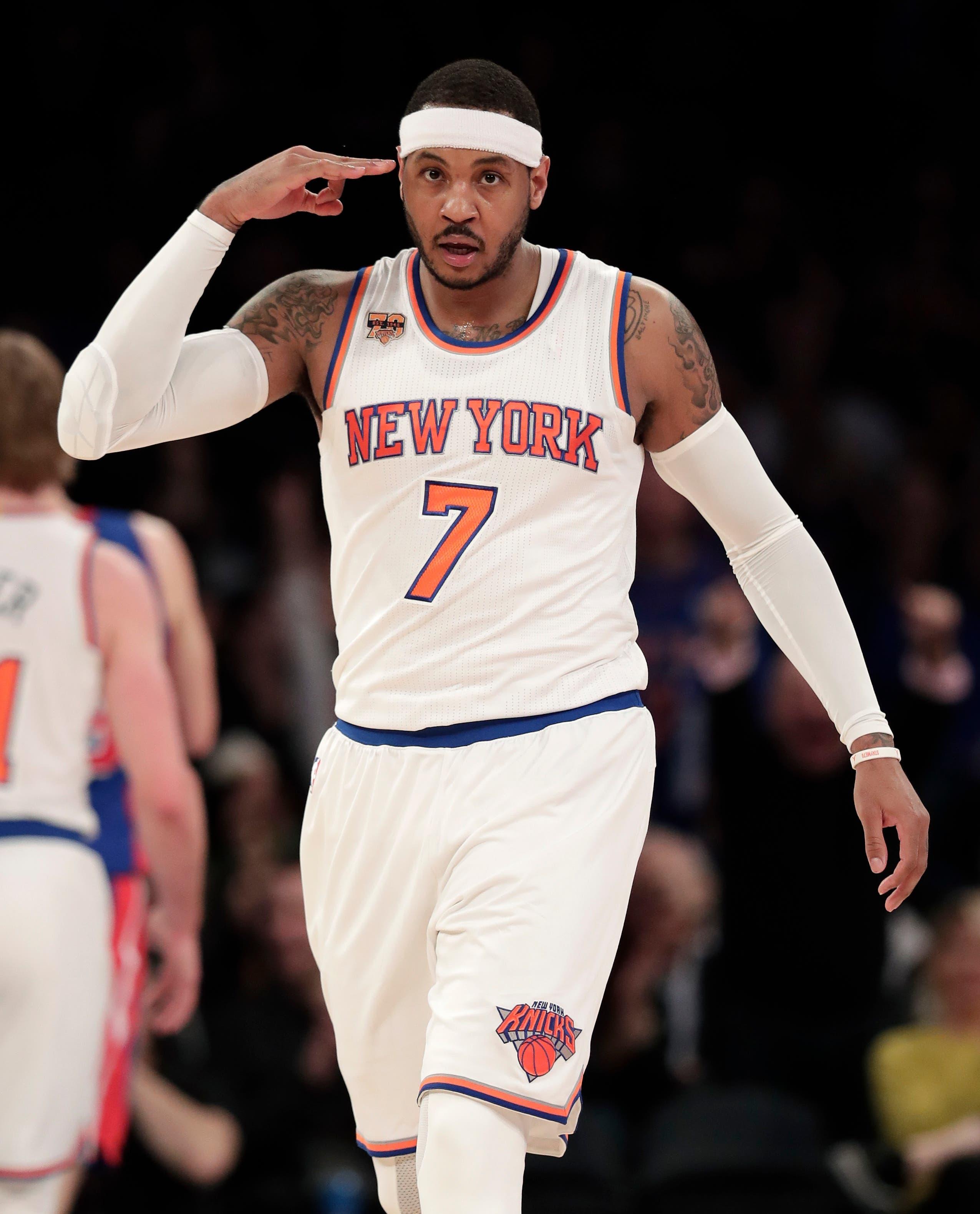 New York Knicks forward Carmelo Anthony (7) reacts after hitting a 3-point shot against the Detroit Pistons during the second quarter of an NBA basketball game, Monday, March 27, 2017, in New York. (AP Photo/Julie Jacobson) / Julie Jacobson/AP