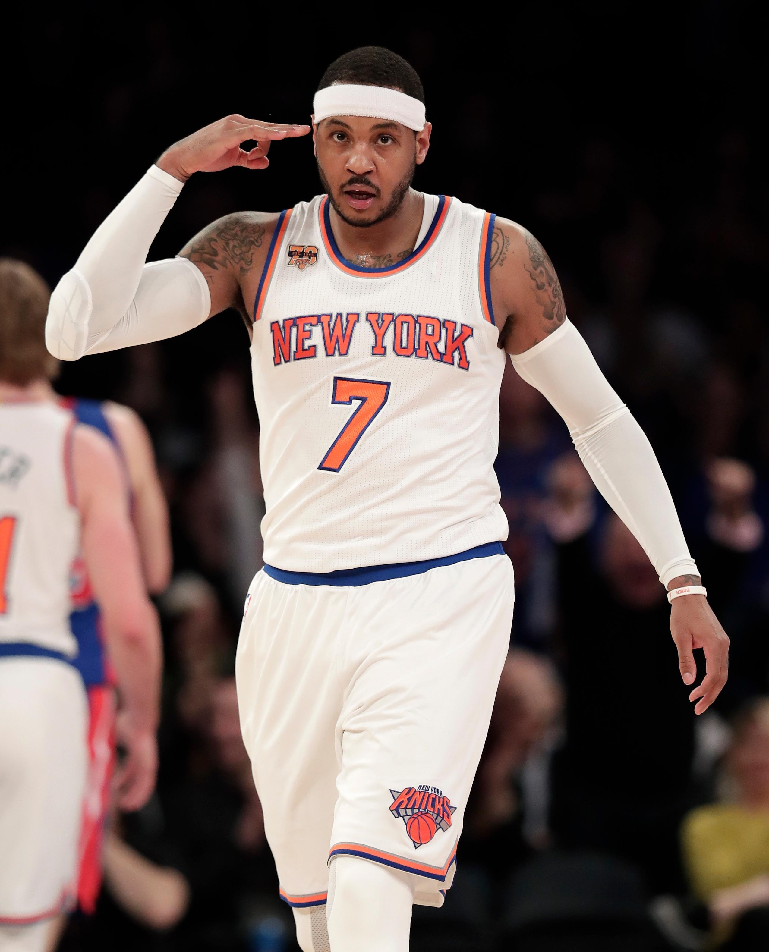 New York Knicks forward Carmelo Anthony (7) reacts after hitting a 3-point shot against the Detroit Pistons during the second quarter of an NBA basketball game, Monday, March 27, 2017, in New York. (AP Photo/Julie Jacobson) 