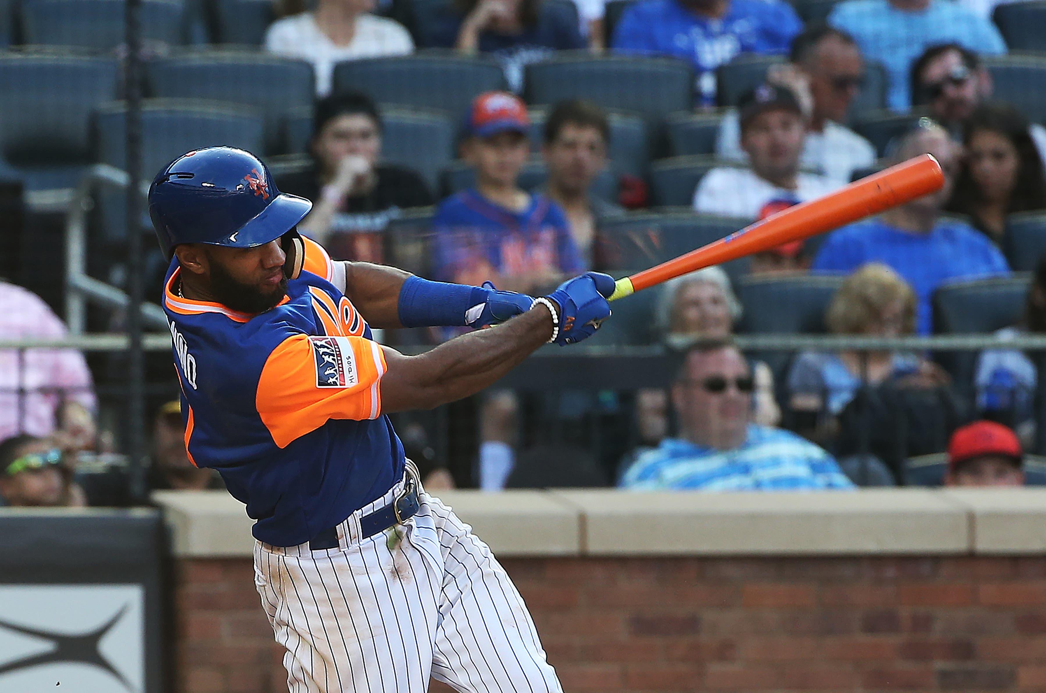 Aug 25, 2018; New York City, NY, USA; New York Mets shortstop Amed Rosario (1) hits a solo home run against the Washington Nationals during the sixth inning at Citi Field. Mandatory Credit: Andy Marlin-USA TODAY Sports / Andy Marlin