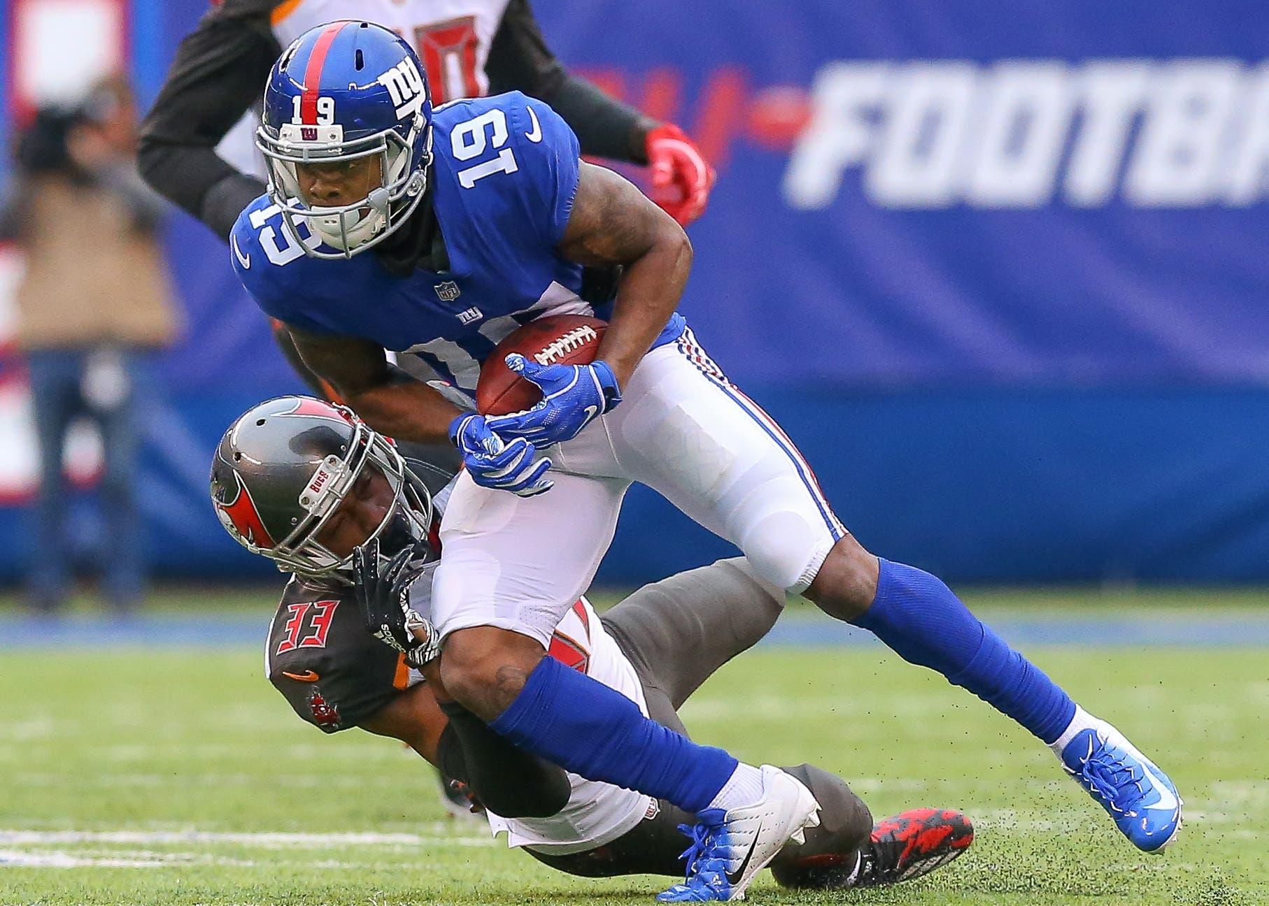 Nov 18, 2018; East Rutherford, NJ, USA; New York Giants wide receiver Corey Coleman (19) is tackled by Tampa Bay Buccaneers cornerback Carlton Davis (33) during the first half at MetLife Stadium. Mandatory Credit: Vincent Carchietta-USA TODAY Sports / Vincent Carchietta