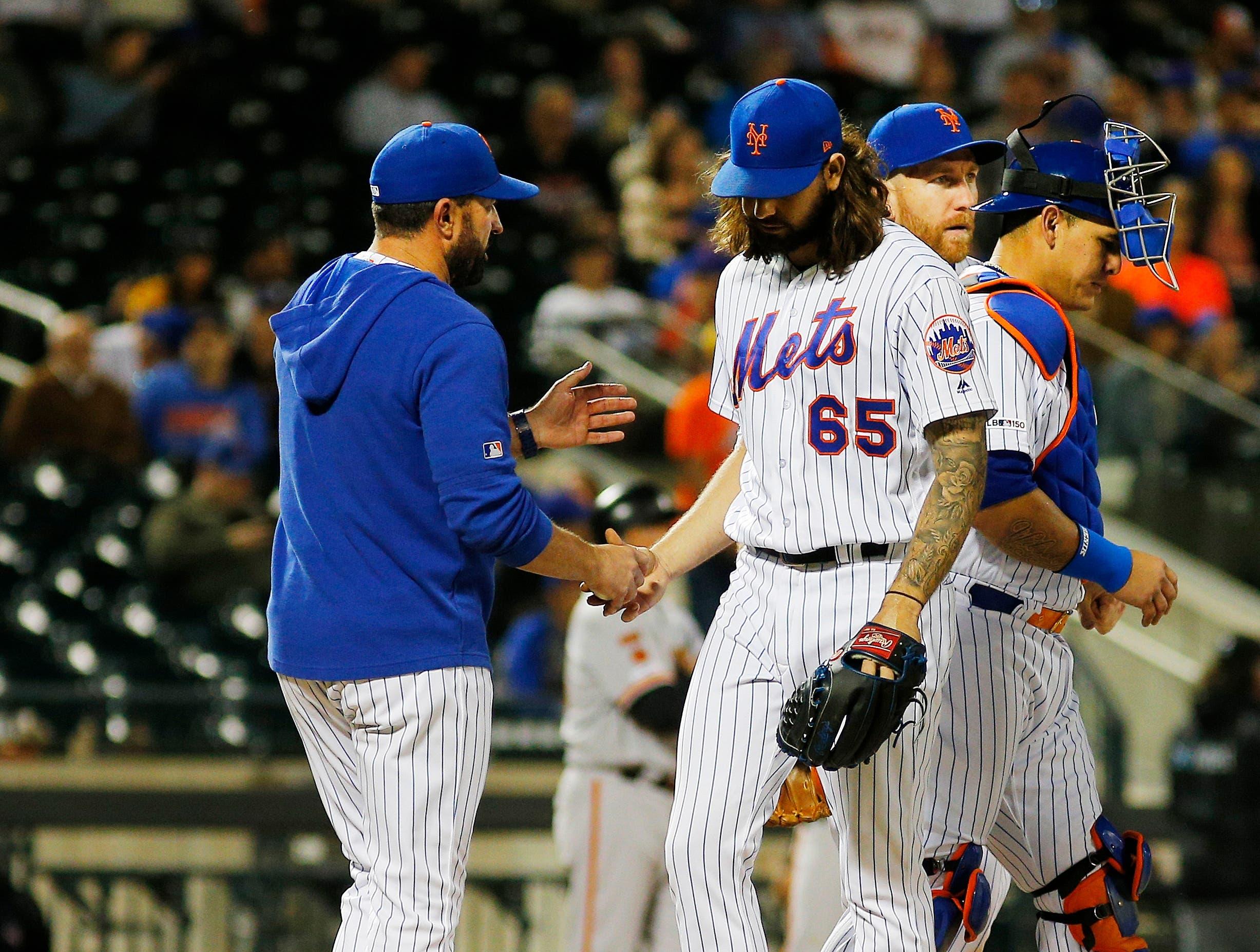 Jun 4, 2019; New York City, NY, USA; New York Mets losing pitcher Robert Gsellman (65) is taken out of the game against the San Francisco Giants during the tenth inning at Citi Field. Mandatory Credit: Andy Marlin-USA TODAY Sports / Andy Marlin