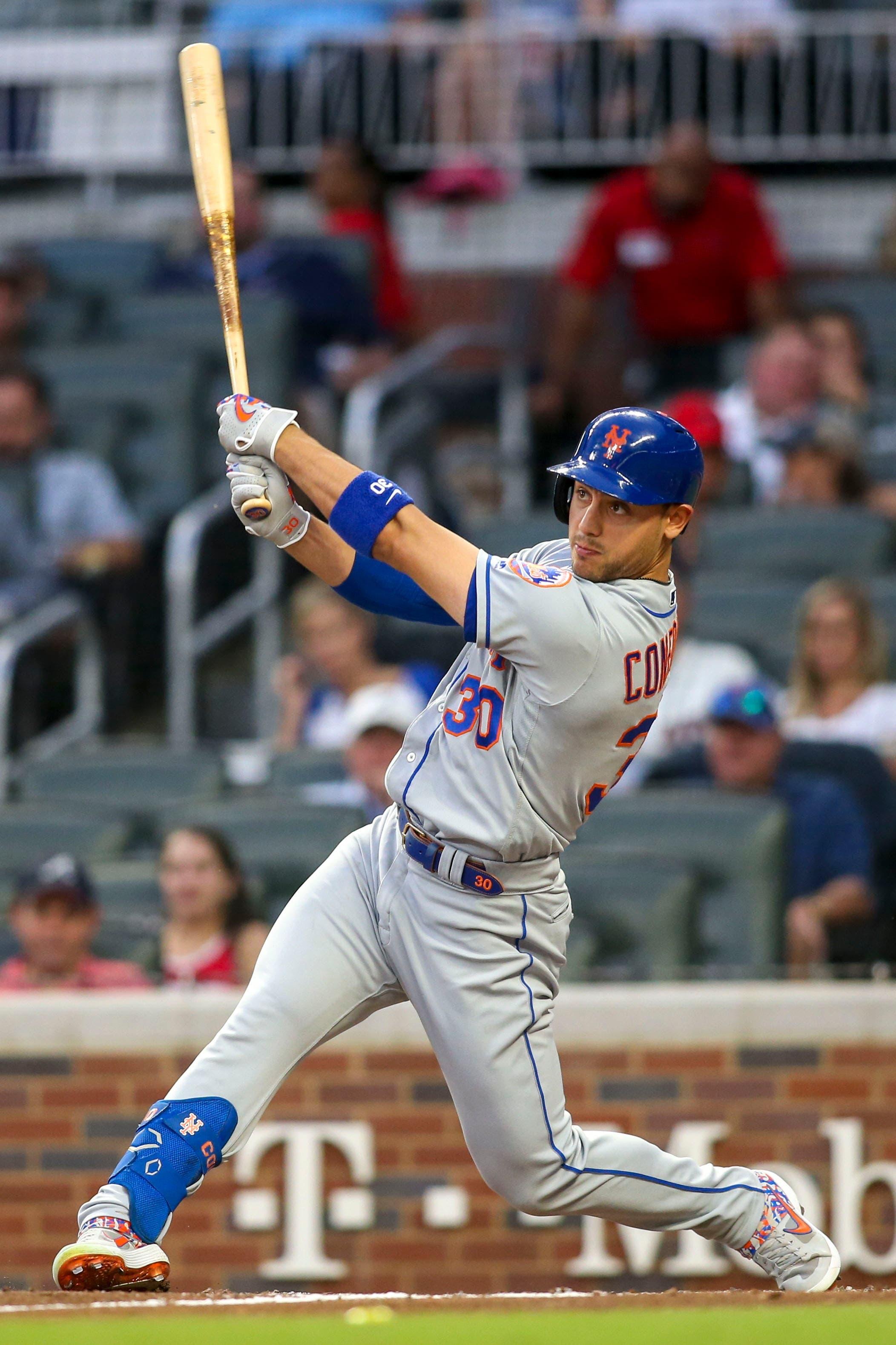 Jun 18, 2019; Atlanta, GA, USA; New York Mets right fielder Michael Conforto (30) hits a RBI double against the Atlanta Braves in the third inning at SunTrust Park. Mandatory Credit: Brett Davis-USA TODAY Sports / Brett Davis