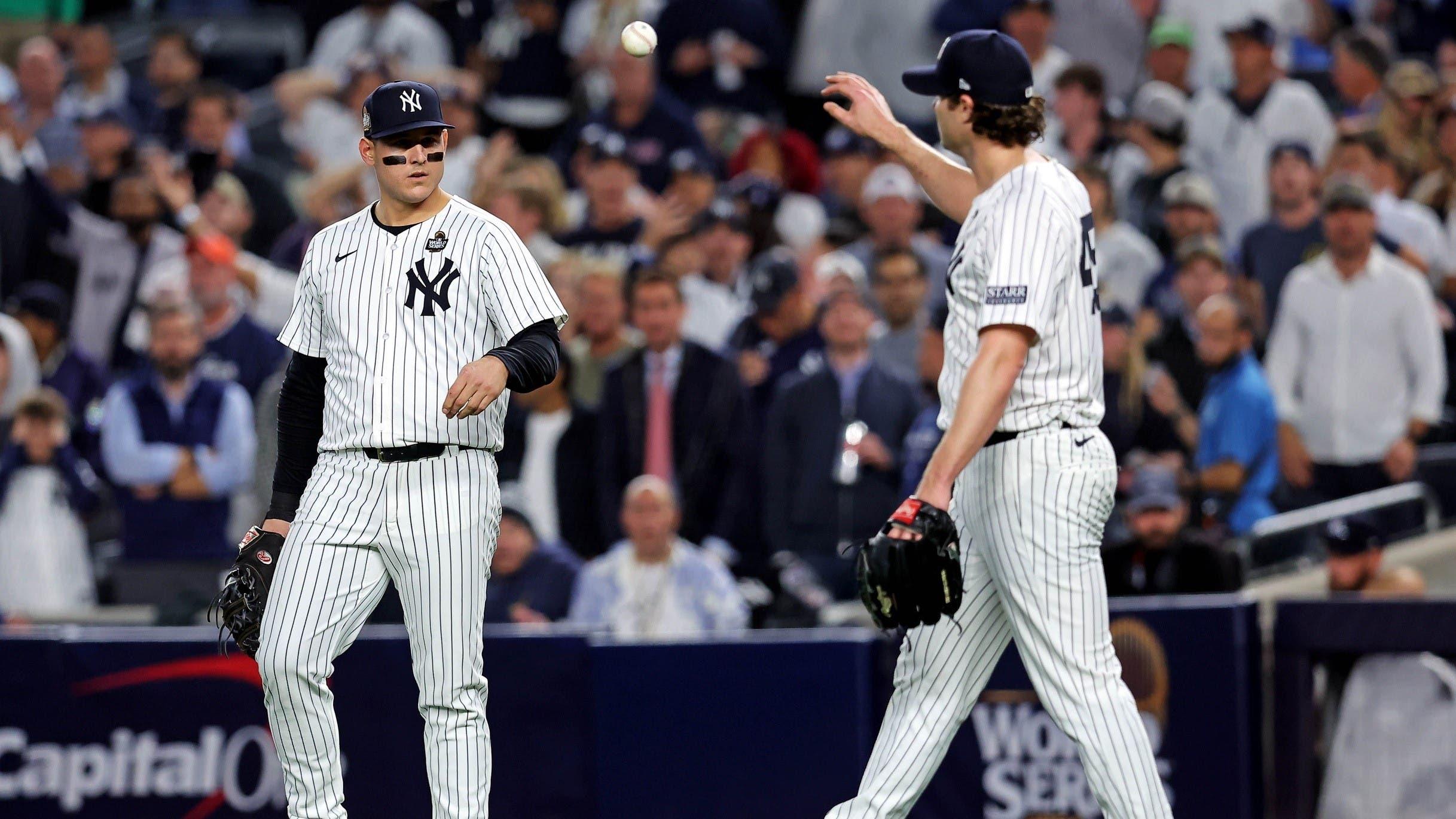 Oct 30, 2024; New York, New York, USA; New York Yankees first baseman Anthony Rizzo (48) talks with pitcher Gerrit Cole (45) after Cole didn’t cover first base allowing a base hit during the fifth inning against the Los Angeles Dodgers in game four of the 2024 MLB World Series at Yankee Stadium. / Brad Penner-Imagn Images