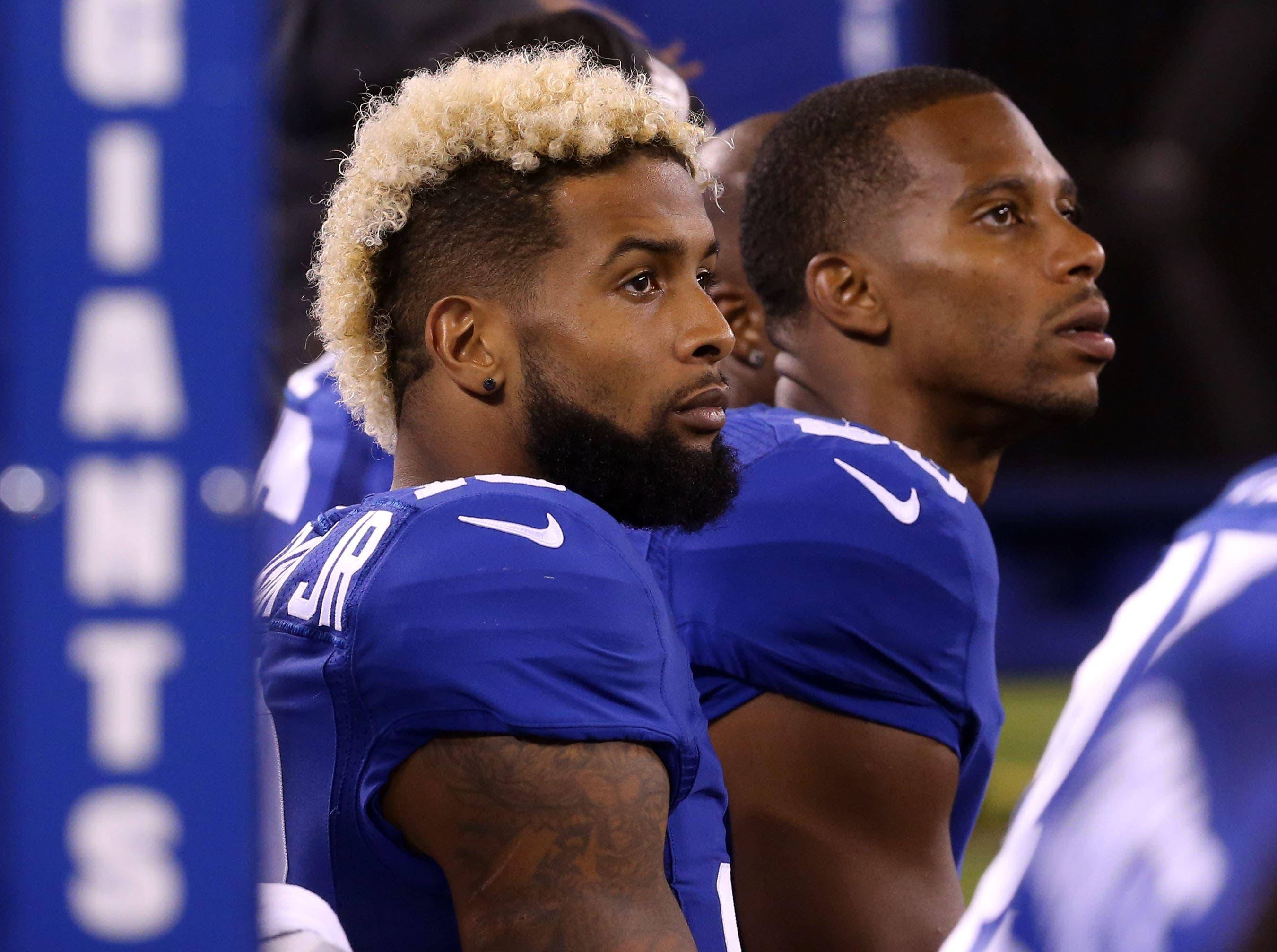 Sep 1, 2016; East Rutherford, NJ, USA; New York Giants wide receiver Odell Beckham (13) and New York Giants wide receiver Victor Cruz (80) watch the action from the sideline at MetLife Stadium. / Ed Mulholland - USA Today