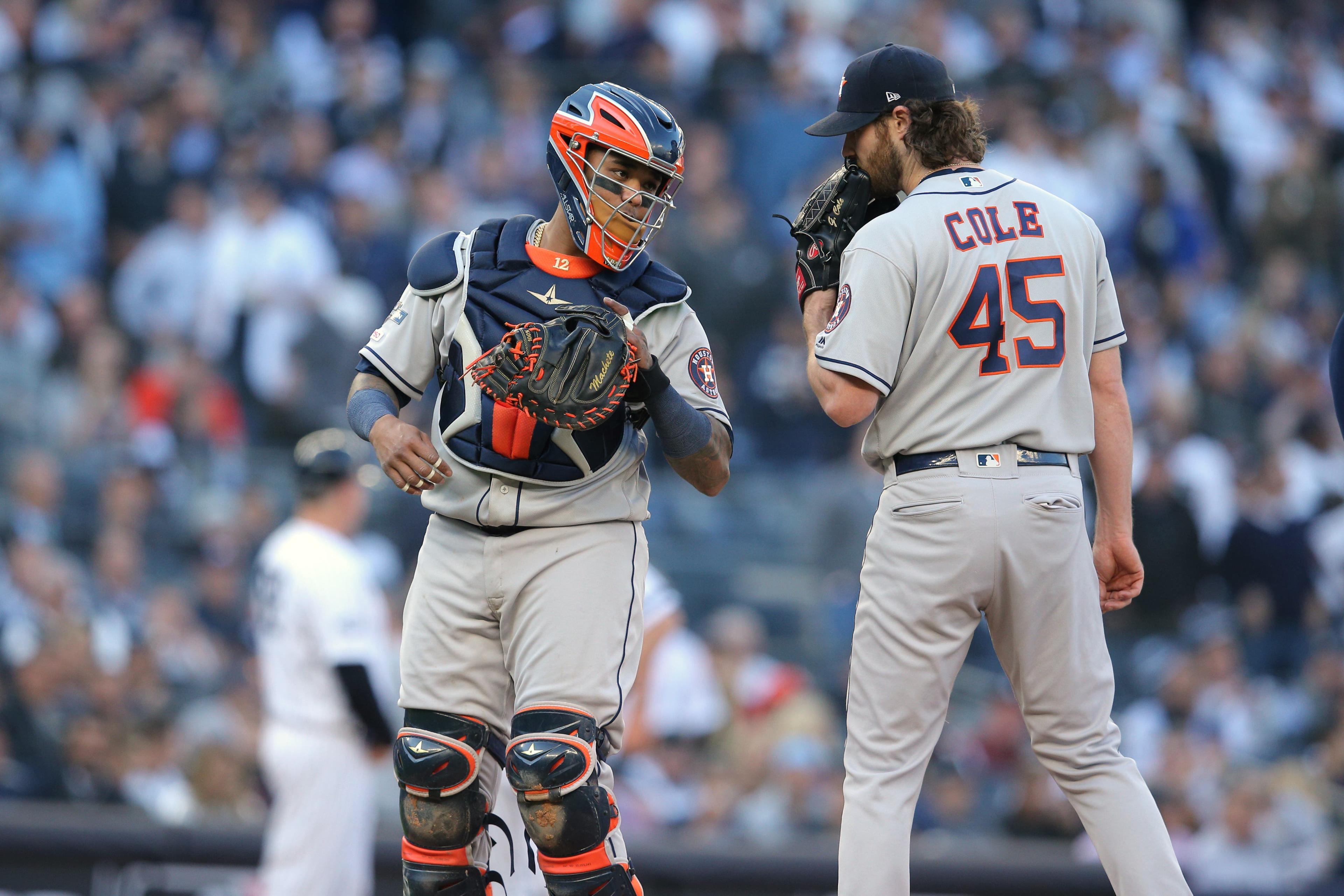 Oct 15, 2019; Bronx, NY, USA; Houston Astros catcher Martin Maldonado (12) talks with starting pitcher Gerrit Cole (45) on the mound during the first inning of game three of the 2019 ALCS playoff baseball series against the New York Yankees at Yankee Stadium. Mandatory Credit: Brad Penner-USA TODAY Sports / Brad Penner