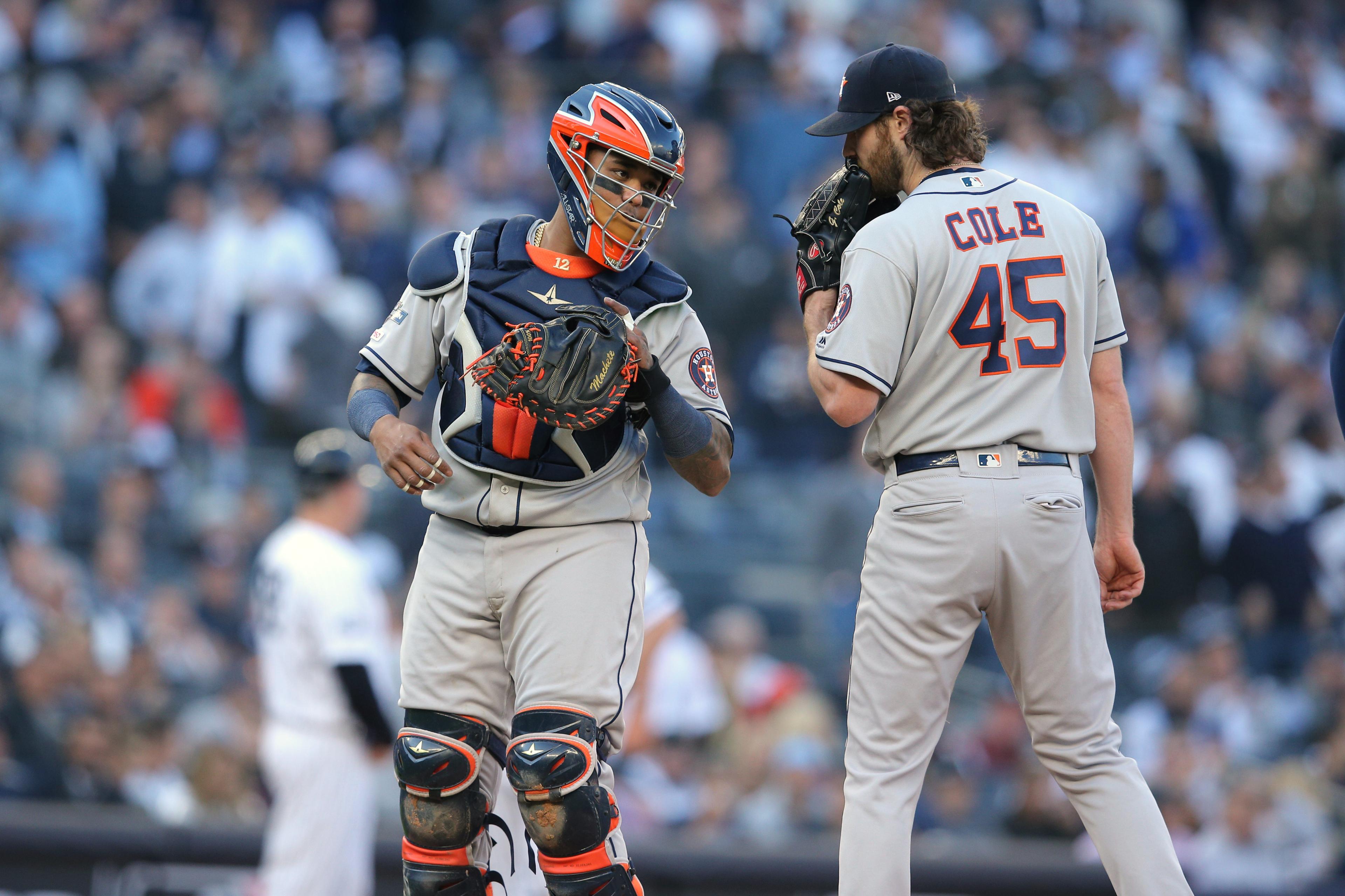 Oct 15, 2019; Bronx, NY, USA; Houston Astros catcher Martin Maldonado (12) talks with starting pitcher Gerrit Cole (45) on the mound during the first inning of game three of the 2019 ALCS playoff baseball series against the New York Yankees at Yankee Stadium. Mandatory Credit: Brad Penner-USA TODAY Sports