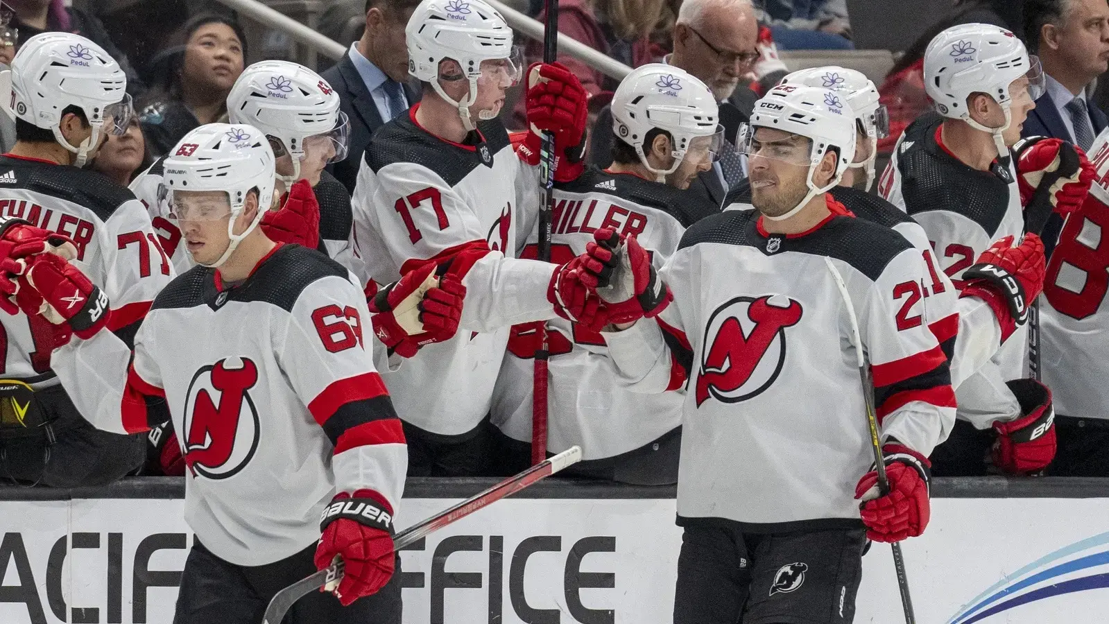 New Jersey Devils left wing Jesper Bratt (63) celebrates with teammates after the goal against the San Jose Sharks during the second period at SAP Center at San Jose. / Neville E. Guard-USA TODAY Sports