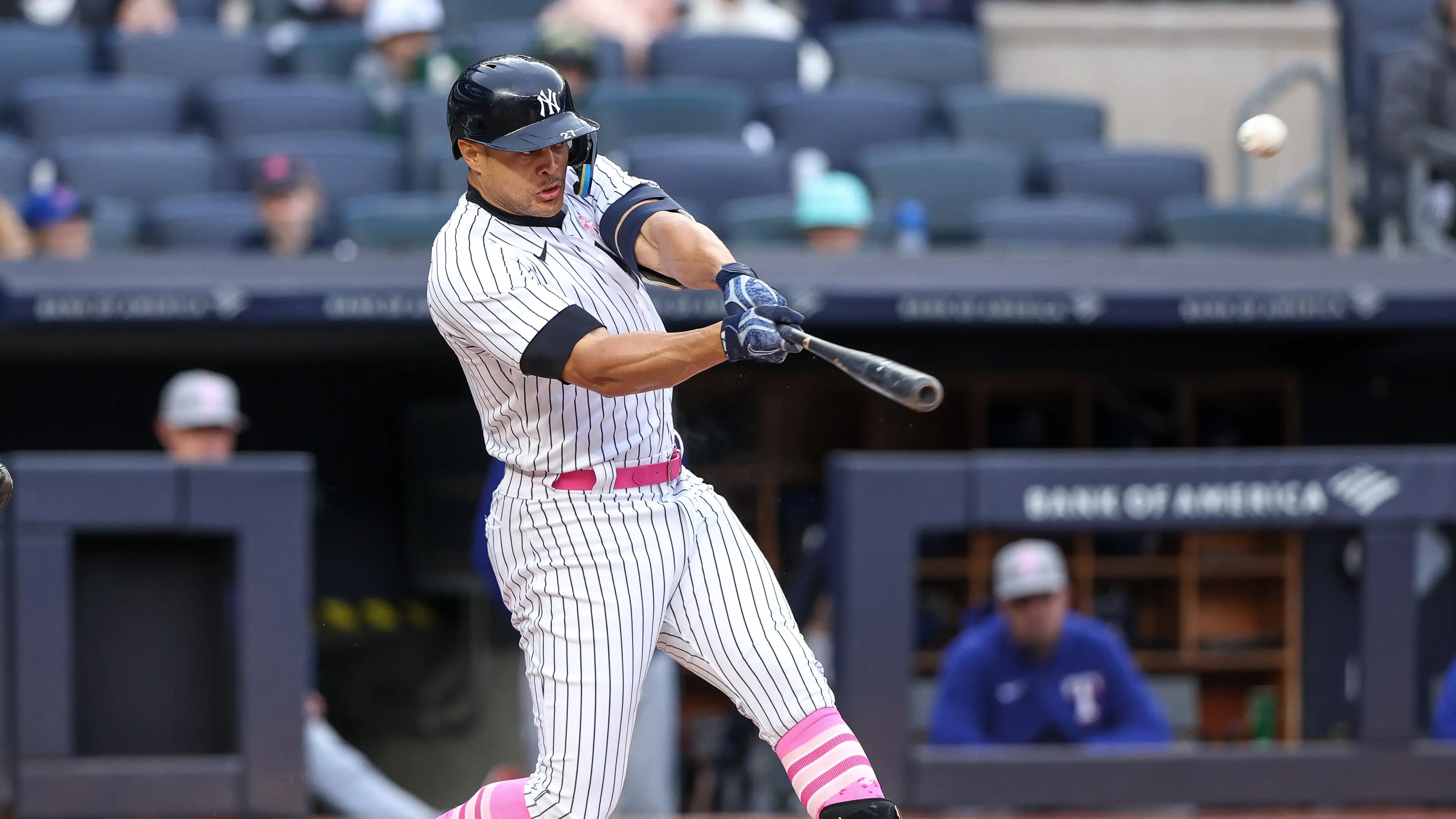 May 8, 2022; Bronx, New York, USA; New York Yankees designated hitter Giancarlo Stanton (27) hits a two run home run during the third inning against the Texas Rangers at Yankee Stadium. / Vincent Carchietta-USA TODAY Sports